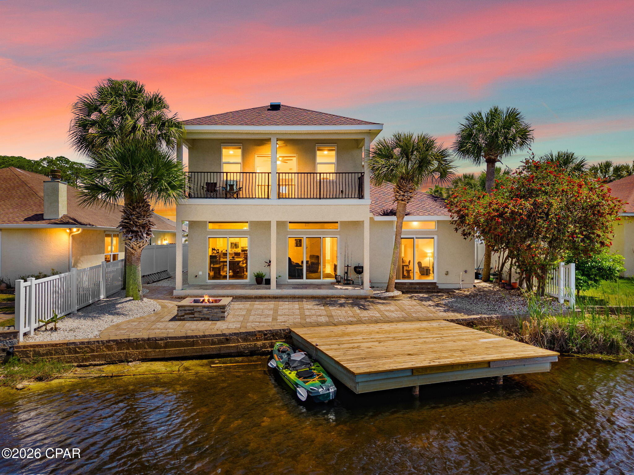 Welcome to this beautifully updated two-story home located in a sought-after gated community, perfectly positioned on a serene lake with nearby beach access. Offering 4 bedrooms and 2.5 bathrooms, this home combines comfort, convenience, and coastal lifestyle living.

The first-floor master suite provides privacy and easy accessibility, while the rest of the home features updated flooring throughout for a fresh, modern feel. The kitchen has been upgraded with new counter tops, back splash and fixtures, offering both style and functionality for everyday living and entertaining.

Upstairs, you'll find additional spacious bedrooms ideal for family, guests, or a home office. Step outside to enjoy tranquil lake views and your brand-new dock--perfect for relaxing evenings, fishing, or launching your favorite water activities.

Located just a short distance from beach access, this home gives you the best of both worlds: peaceful lakefront living and easy days by the shore. Situated within a secure gated community