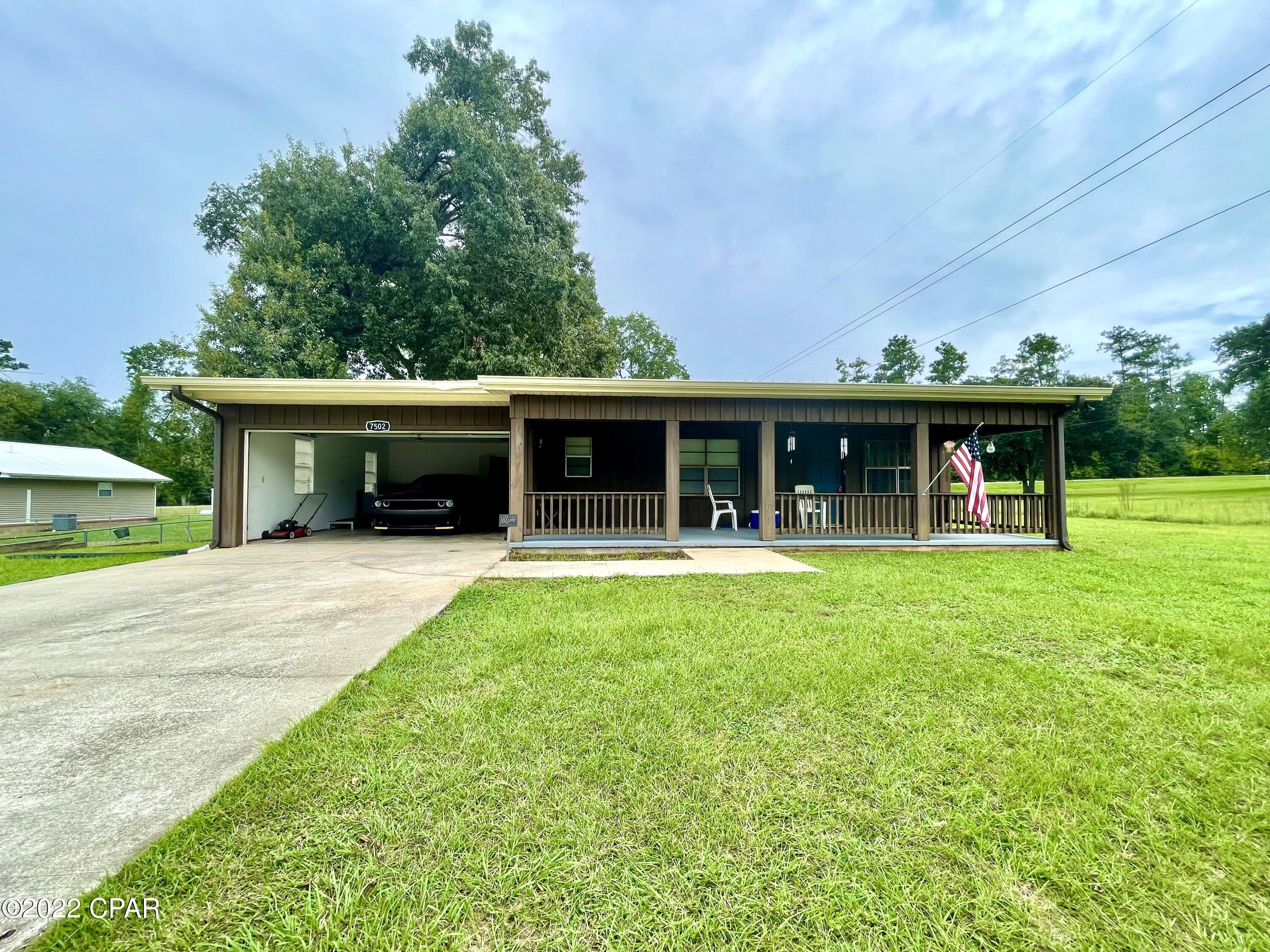 CURRENTLY UNDER CONTRACT, SELLER WILL CONSIDER BACKUP OFFERS.  2/2 with a garage in Sneads with Hwy 90 frontage ready for new owners! Home has an open living area with a separate den, a one car garage with laundry, and a beautiful covered porch for sitting! The back yard features a deck, outbuilding for storage and a pole barn! Well, HVAC, and roof are all less than three years old. This one is move in ready! Make an appointment to see it today!