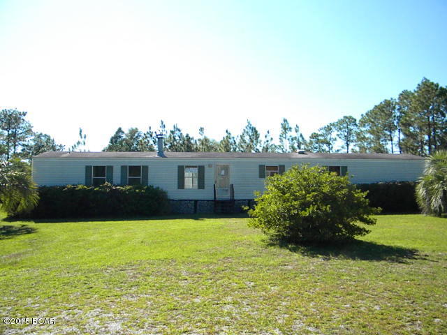 Single wide mobile home on 5 acres with some of the property chain link fenced for the kids and pets, with a large 20 x 18 deck perfect for grilling, master bathroom with dual sinks, garden tub and separate shower, split floor plan, storage shed, just a short distance from a paved road, needing to have some updates to make it your own.  Don't miss out on this one.