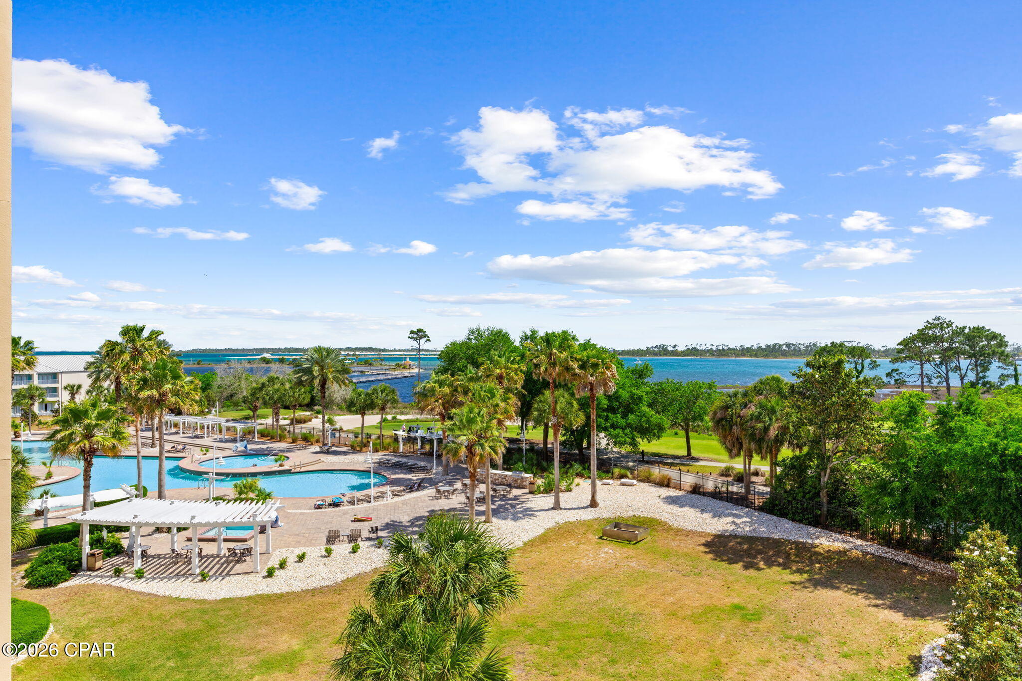 Indulge in refined coastal living in this stunning residence at Bay Point Reflections Condominium, offering breathtaking bay views and upscale updates throughout. Spanning 2,099 square feet, this beautifully designed 3-bedroom, 3-bathroom condominium features new flooring throughout and an open, light-filled layout ideal for both relaxing and entertaining.

The spacious living area flows seamlessly onto an open balcony where you can unwind and take in serene water views and watch the boats go by, while an additional screened-in balcony provides the perfect space for year-round enjoyment. The well-appointed kitchen enjoys the stunning bay view and offers ample cabinetry and functionality, complementing the home's effortless flow.

The primary suite serves as a private retreat, and each additional bedroom offers comfort and flexibility for guests. Located within the desirable Bay Point community, residents enjoy a peaceful waterfront setting with convenient access to the golf course, dining, shopping, and area attractions.

A rare opportunity to own a beautifully updated bayfront residence combining space, views, and lifestyle.