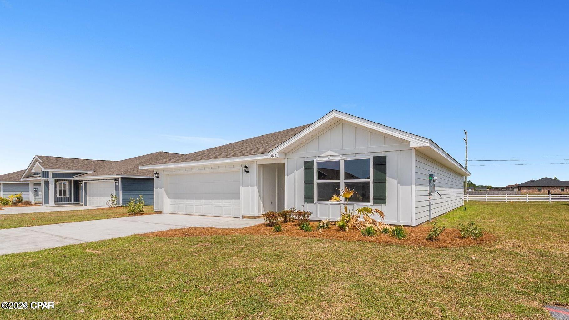 Approved short Sale. Fridge included and landscaping updates have been made since photos were taken. The Aldridge is a thoughtfully designed one-story home located in the desirable Hodges Bayou Plantation community in Southport, Florida. This 3-bedroom, 2-bath floorplan offers 1,272 square feet of comfortable, functional living--perfect for first-time buyers or those looking to downsize without sacrificing style.

Inside, you'll find 8-foot ceilings throughout, durable engineered vinyl plank flooring in the main living areas, and soft carpet in the bedrooms. The open-concept living room and kitchen create a welcoming space for everyday living and entertaining. The kitchen features quartz countertops, white cabinetry, a center island ideal for casual dining or serving, a spacious walk-in pantry, and stainless-steel appliances including a smooth-top range, microwave, and dishwasher. The adjacent dining area makes mealtime and hosting seamless.

The primary bedroom is conveniently located at the front of the home and includes a large walk-in closet and a private ensuite bath with double vanity, quartz countertops, and a walk-in shower. The two additional bedrooms are well-sized and share a guest bathroom with quartz countertops and a tub/shower combination.

Additional features include a 2-car garage and a layout designed for both comfort and efficiency. This home offers a clean, modern feel in a quiet community--ready for its next owner.