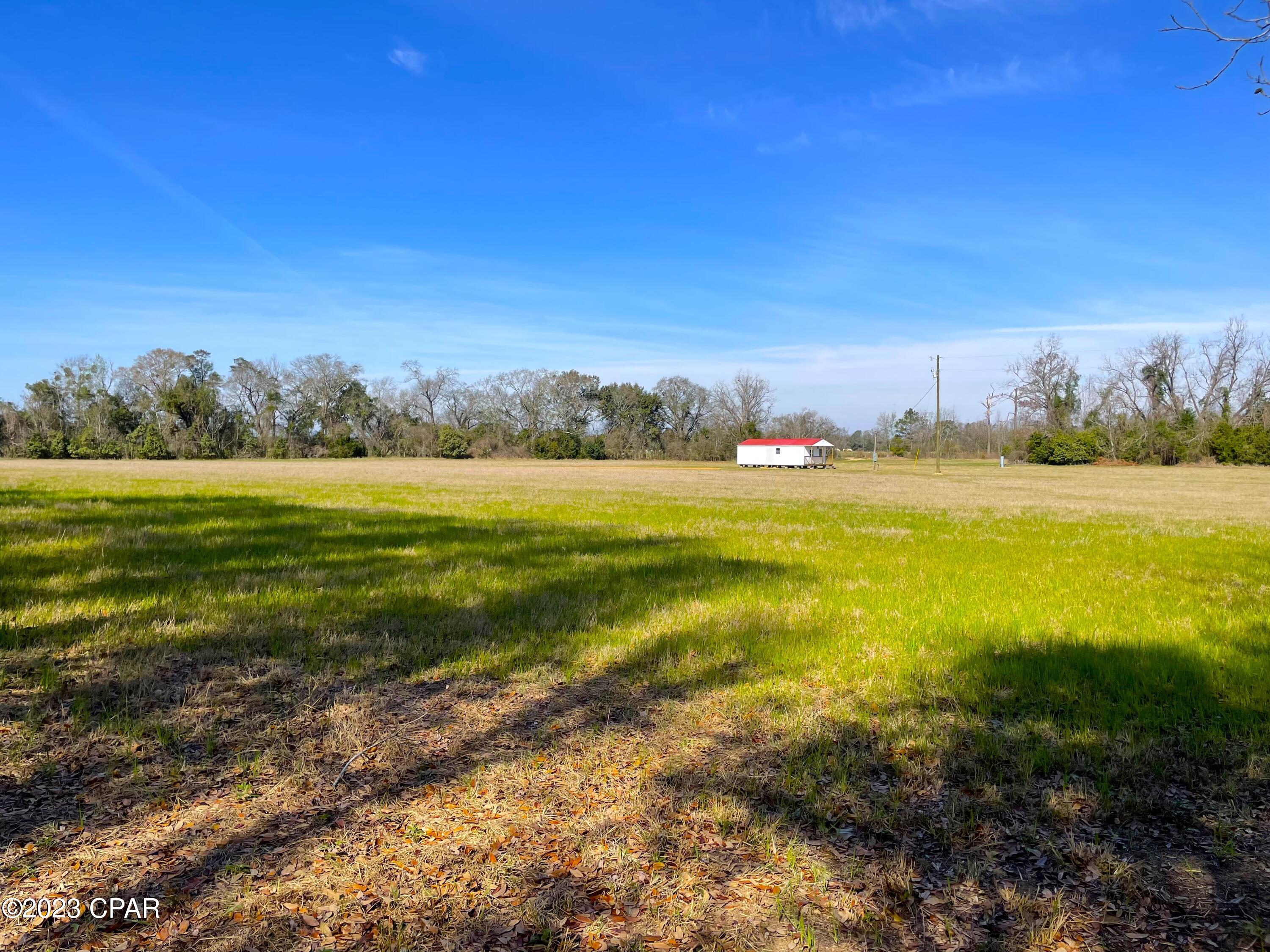 Don't miss out on the opportunity to buy this prime acreage sitting on Highway 2!! Sitting at over 10 acres, this property has a 560 sq. ft. shed that could be turned into a small home. A brand new well and septic have also been added which is perfect for someone looking for a homesite. The electric has also been set up for an RV to be able to use so the possibilities for this land are endless.