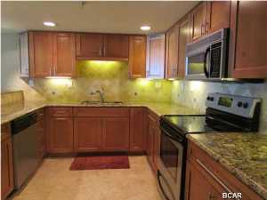 $10,000 PRICE REDUCTION on this one of a kind condominium at The Watercrest! Sellers completely remodeled ($60,000+) this spacious one bedroom/two bath unit. It has been their second home and it shows! Great views of the gulf. This large kitchen is state of the art with granite counter tops, custom cabinetry, stainless appliances, under cabinet lighting, tile back splash and large pantry. Master bedroom has plenty of space and features a walk-in closet. Both baths have fully tiled walk-in showers, granite counter tops and custom cabinetry. Separate laundry room and owners' storage. Many extras with attention to all details! The Watercrest's architectural design, open space with beautifully landscaped atriums, covered walkways and first class clubroom, make this a unique property.