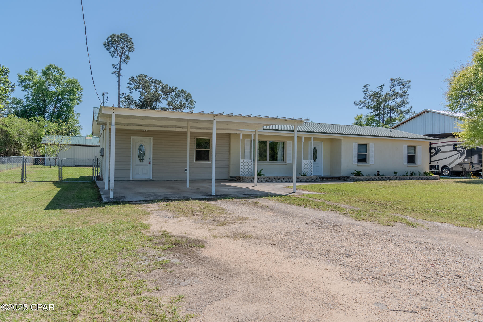 Currently under contract with a 72 hour kick out clause.  The elusive four bedroom home...now available in Marianna, conveniently located just a couple miles from Wal-Mart and Lowes. This home features a split floor plan and newly remodeled bathrooms. In addition to the four bedrooms, you will have two living areas to spread out the friends or family! The enclosed back patio gives plenty of option for afternoon cookouts with a view of the large back yard. If you're into homesteading, you will be ahead of the game here with a very nice chicken coop already in place! The garage has ample storage or workshop space with lighting as well. This is a great opportunity to own an amazing home at a reasonable price. Make an appointment to see it!  Some photos are staged virtually.