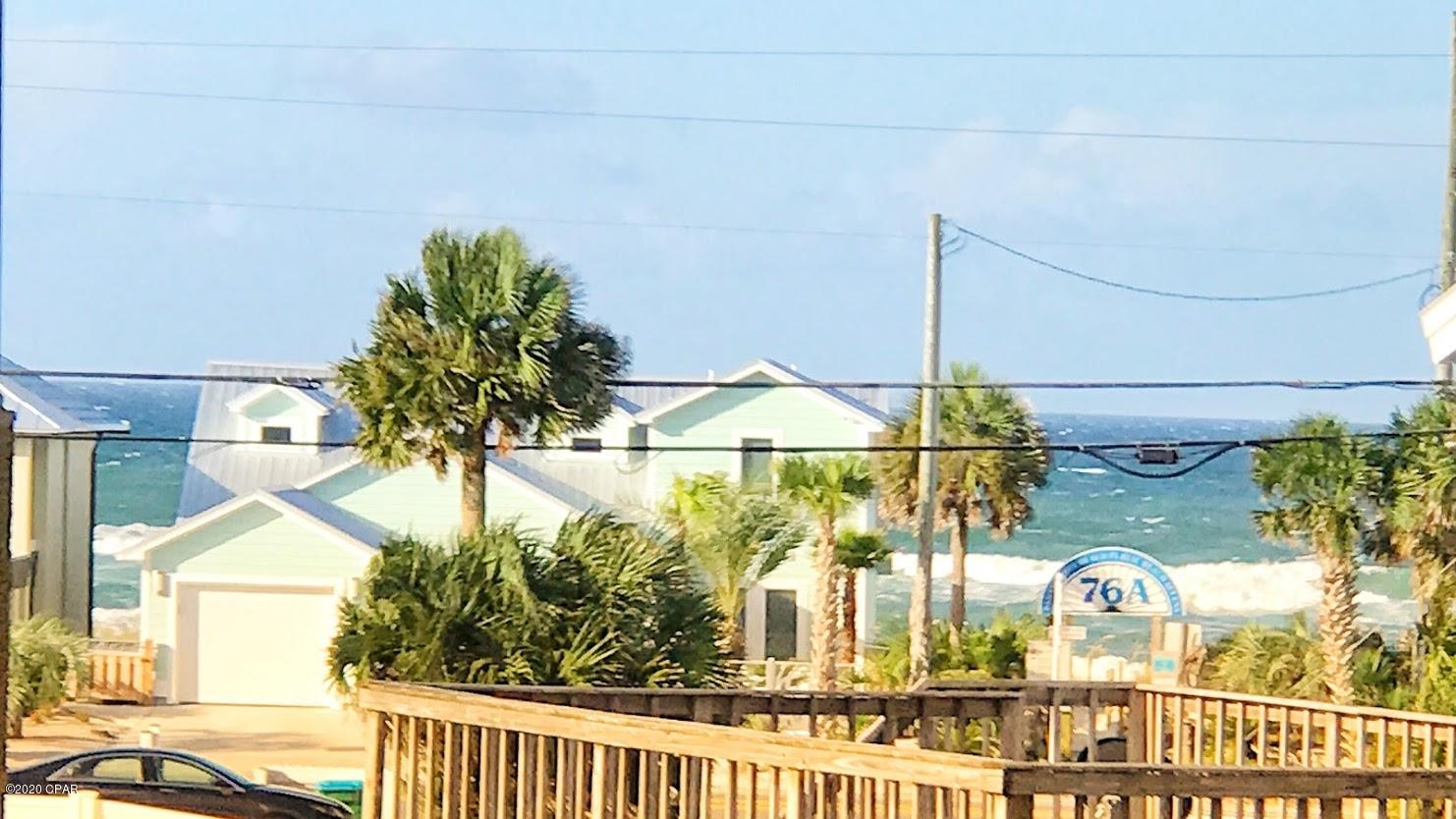 TALK ABOUT LOCATION!  LOOKING FOR A ''WALK TO THE BEACH HOME!''  This 3 Bedroom – 2 Bath Beach Cottage is about 3 homes off of the beach!  No need for a golf cart, you can walk to the beach access point in about 5 minutes!  NO HOA fees. The master bedroom is located on the first floor.  This home is in beautiful move-in condition, tastefully decorated and was completely renovated in 2017 to include:  a new metal roof, new kitchen counter tops and smooth top stove, stainless steel appliances, stacked washer/dryer, tiled floors throughout, new bathroom vanity's, new fixtures, new doors, new paint inside and out.  What more could you wish for – how about a view of the Gulf from the upstairs deck! The home is being sold furnished including two king size beds and bunk beds. The two upstairs bedrooms offer guest privacy and share a jack 'n jill bathroom.  And, YES there is ample room for a pool!  Additionally, there is a ground level wooden deck in the back yard.   An oversized parking area provides an abundance of parking area.  The back yard is entirely fenced and there is a well for irrigation purposes.  If you are a potential beach home buyer, you should give this home very serious consideration - its location, condition and price point make it rare find on Panama City Beach!  The dimensions, age and square footage are approximates.