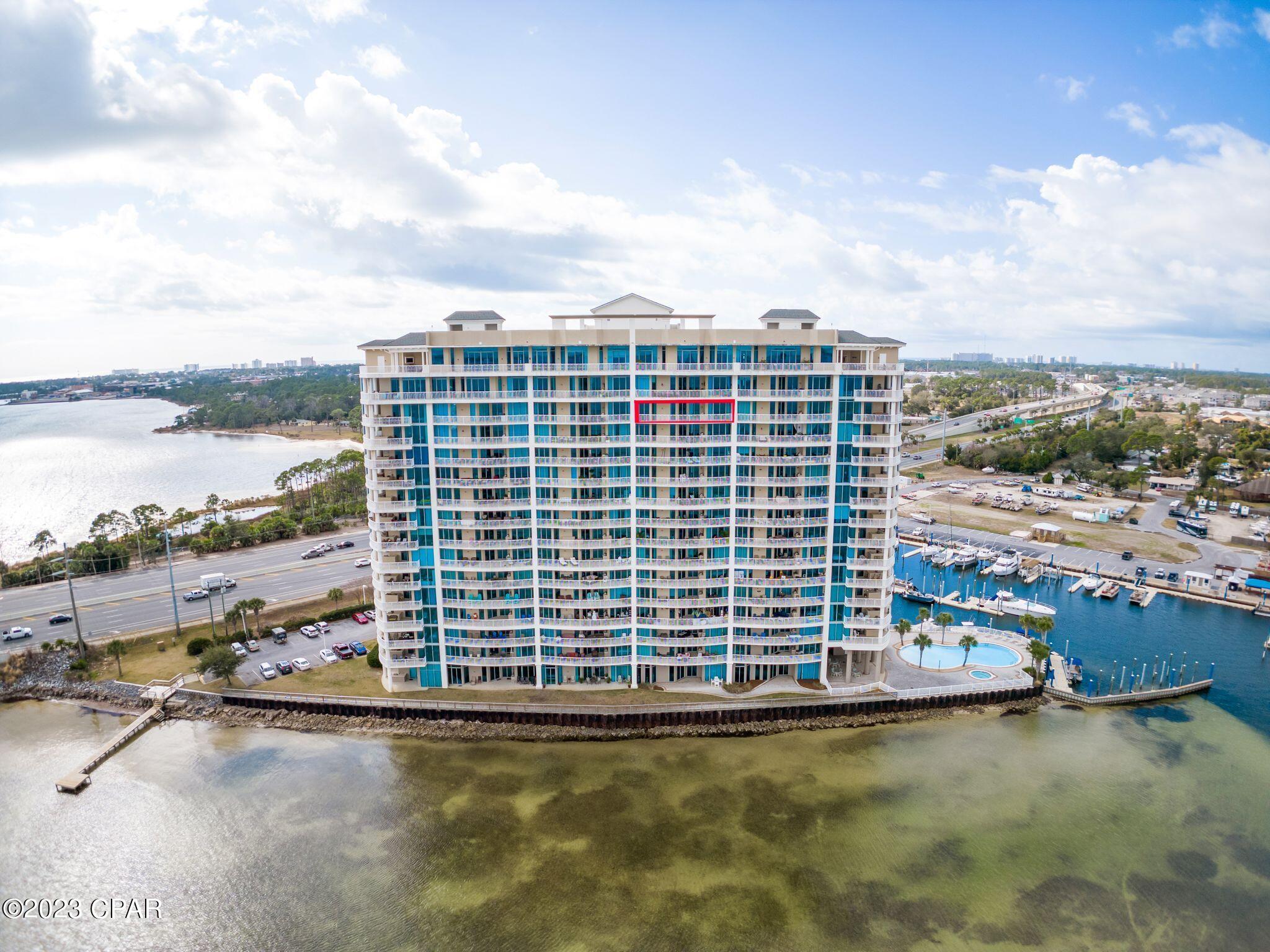 UNDER CONTRACT. SELLER ACCEPTING BACKUP OFFERS. Bayfront living at its Best!! Welcome to your gorgeous new 2 Bed/2 Bath, Bayfront condo, with a spacious private balcony, located in Marina Landing, one of Panama City Beach's most sought after waterfront residences. Enjoy beautiful Bay Views from almost every room of this stunning condo, including the main living areas. Every bedroom has stunning Water Views, balcony access, private en-suite bathrooms, and spacious walk-in closets. You'll love the luxurious 12 foot ceilings, floor to ceiling windows, and the Chef Designed Kitchen offering an abundance of cabinetry, granite countertops, breakfast bar, stainless steel appliances and full pantry. Enjoy Miles of Beautiful Bay Views from your expansive private balcony, with a stainless steel grill, which is perfect for entertaining guests. This upscale property will make the perfect year round residence or second home, and long-term rental leases are permitted. Marina Landing offers many amenities, including a Resort like pool and spa overlooking the Bay, tropical landscaping, quiet sitting areas, conference room, and waterfront health & fitness center. This condo includes designated garage parking, as well as a spacious owner's closet, located just across the hallway from the unit. Marina Landing is in a premier location, nestled in between Panama City and Panama City Beach, just minutes away from the Gulf of Mexico, Shell Island and Intercoastal Waterway. Do you enjoy boating? There is a Private, deep water Marina, on site, with boat rentals and boat slips available for lease. Boaters will enjoy the convenient marina and easy access to the Bay & Gulf, Inter-coastal, East to Apalachicola or West to Destin. Call today to see this condo in person!