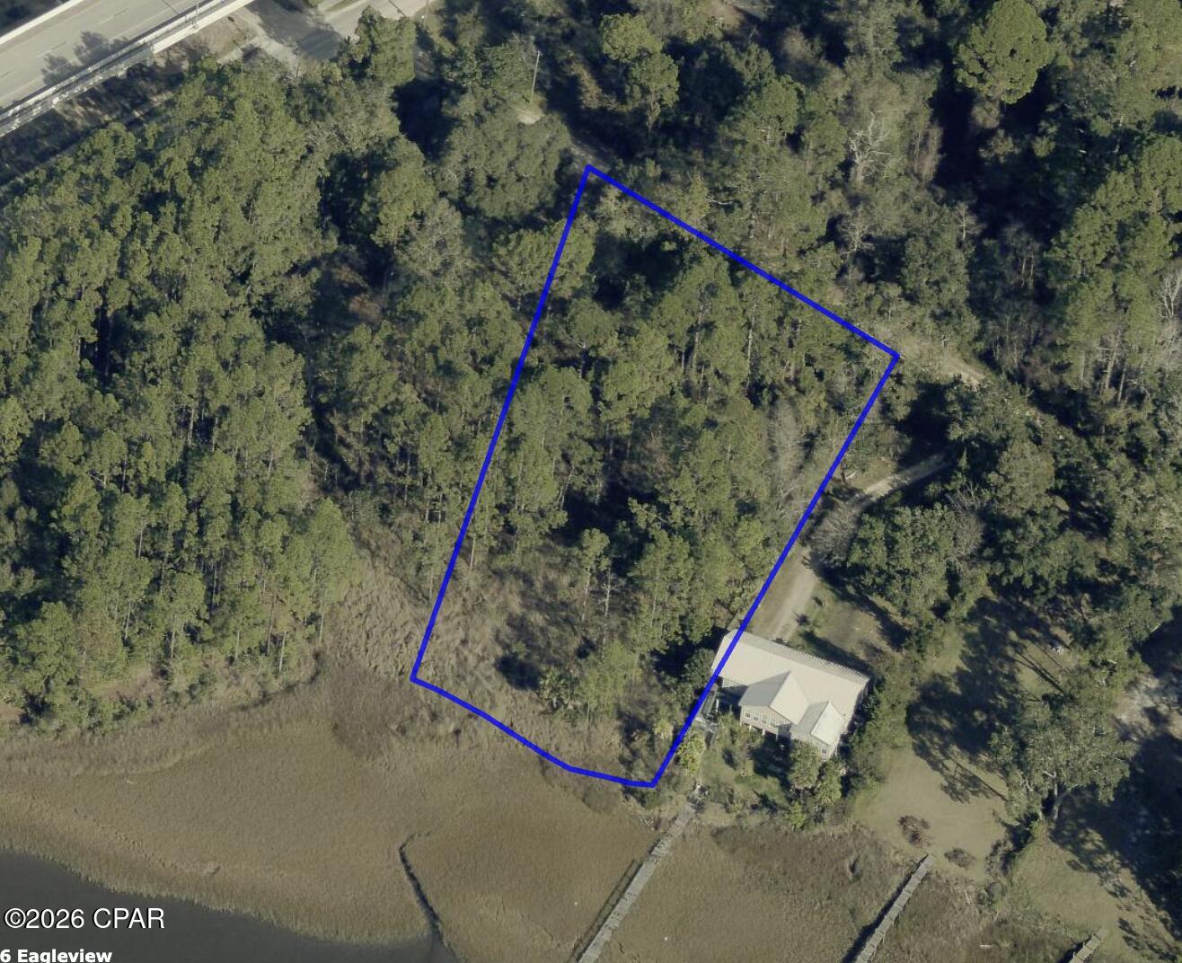 LOCATION, LOCATION, LOCATION!!!  Here is your chance to own a prime waterfront lot in Westbay Florida - less than 1 mile from the entrance to Latitude Margaritaville!  This property is currently zoned residential, with the future land use already established as Westbay Center - which offers commercial development potential.  Property has great elevation and a beautiful view of Westbay and the ICW.  Build your bayfront dream home or just buy and hold... the future is bright for Westbay!