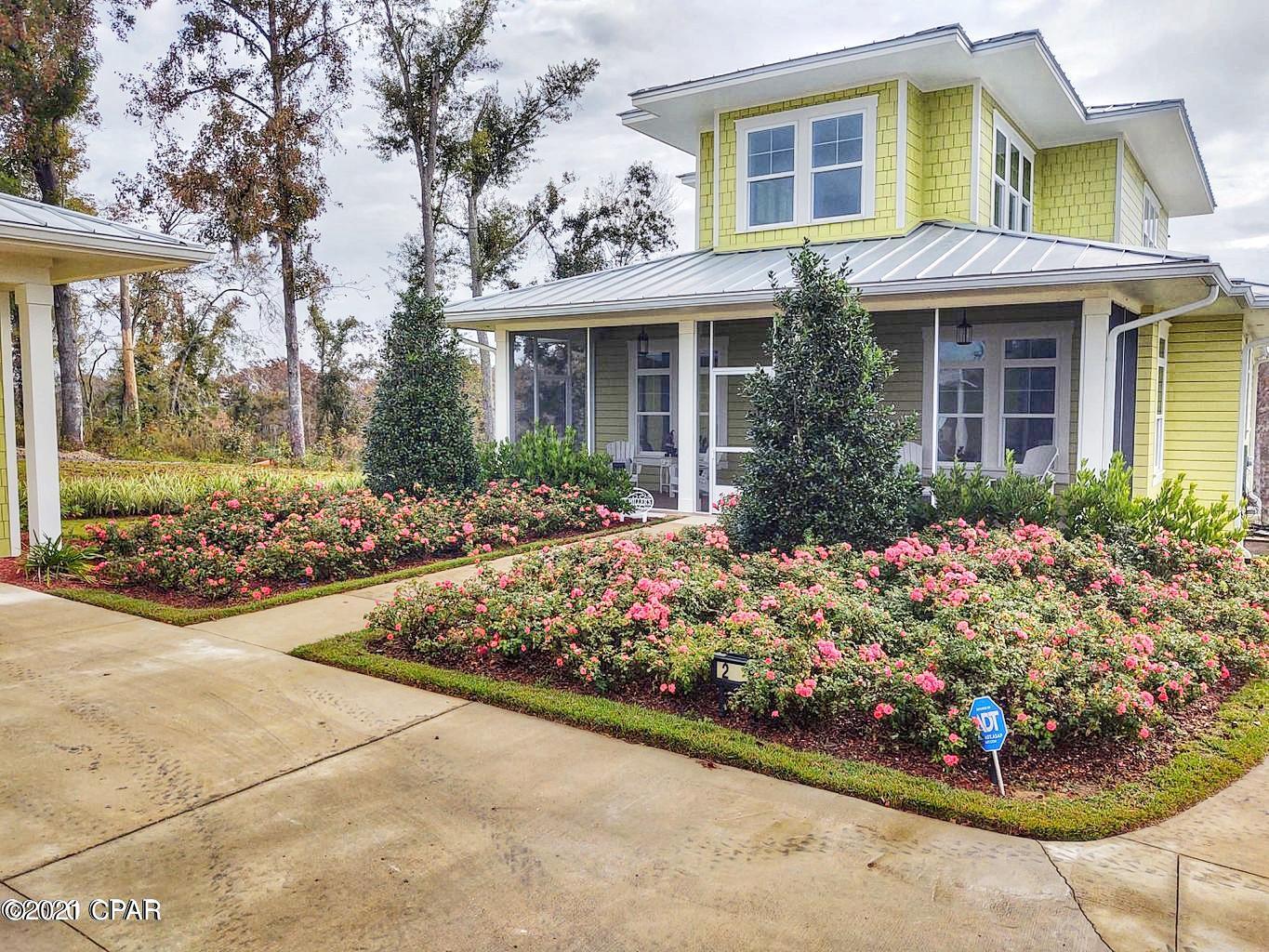 SPRING PRICE REDUCTION!!  On a NEW, BEACH STYLE, WATERFRONT HOME.  This lovely new home sits on over an acre of waterfront on the pristine waters of Merritt's Mill Pond near Marianna, FL.  The waters of this lake feed from five Catagory 1 natural springs which pour out over 80,000 gallons of pure spring water every day!  This 3400 sf waterfront home is a four bedroom, four bathroom beauty designed for comfort and enjoyment.  The outside appears to be a beautiful wood home, but the siding and soffets are all made of Hardi-board for maintenance free living.  The roof is a raised seam metal roofing with over a 50 year warranty.   A nicely curving, concrete driveway leads from the adjacent roadway to the entrance of a completely finished, double garage and the front area of this outstanding ho A nicely curving, concrete driveway leads from the adjacent roadway to the entrance of a completely finished, double garage and the front area of this outstanding waterfront home. Sitting next to the garage is an inviting fire pit area, which blends into the total design concept.  

The bright and cheerful home interior features 10 foot ceilings, transom lights, barn doors, 100 year old antique re-purposed doors, shiplap siding walls, drywall ceilings, stylish ceiling fans, beautiful chandiliers, granite countertops, manufactored wood flooring throughout main home, etc.

Exterior enjoyment is complete with a beautiful dock, with cover sitting and party area, water slide, and boat docking cleats.  Immediately off the dock and party area is the pristine, spring fed waters of the lake for your summer and winter enjoyment.  As these waters stay a constant 68 degrees, you can actually enjoy swimming in them during the winter months!  You may also enjoy scuba diving in our beautiful underwater cave systems, try your hand at catching huge largemouth bass, or even a World Record Shell Cracker!!
