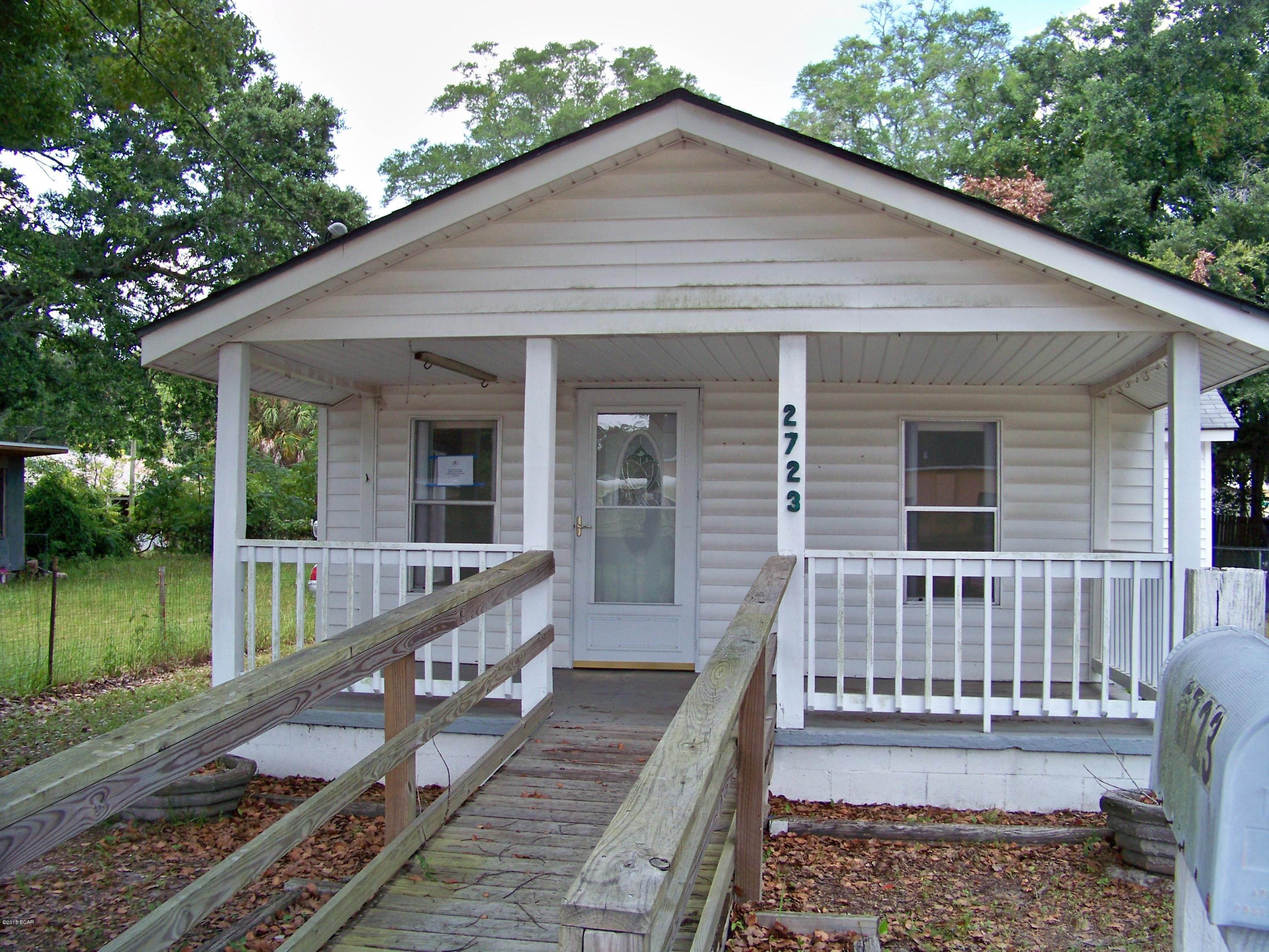 This charming three bedroom one bath cottage home is located in an X flood zone just a short drive from both downtown Panama City and historic Millville.  Covered front porch perfect for a swing or rocking chairs. Living room opens up into the dining area so that family and guests won’t feel separated.  The spacious kitchen provides lots of cabinet and counter space. From your kitchen window you look out over a generous back yard. Two bedrooms are in the rear of the home on either side and a third bedroom is off the dining room. This home simply needs the right owner to bring it back to life. This opportunity won't last long so don't delay in making your appointment to see this Fannie Mae Homepath Home. All measurements, ages, and room sizes are approximate. Please verify if important.