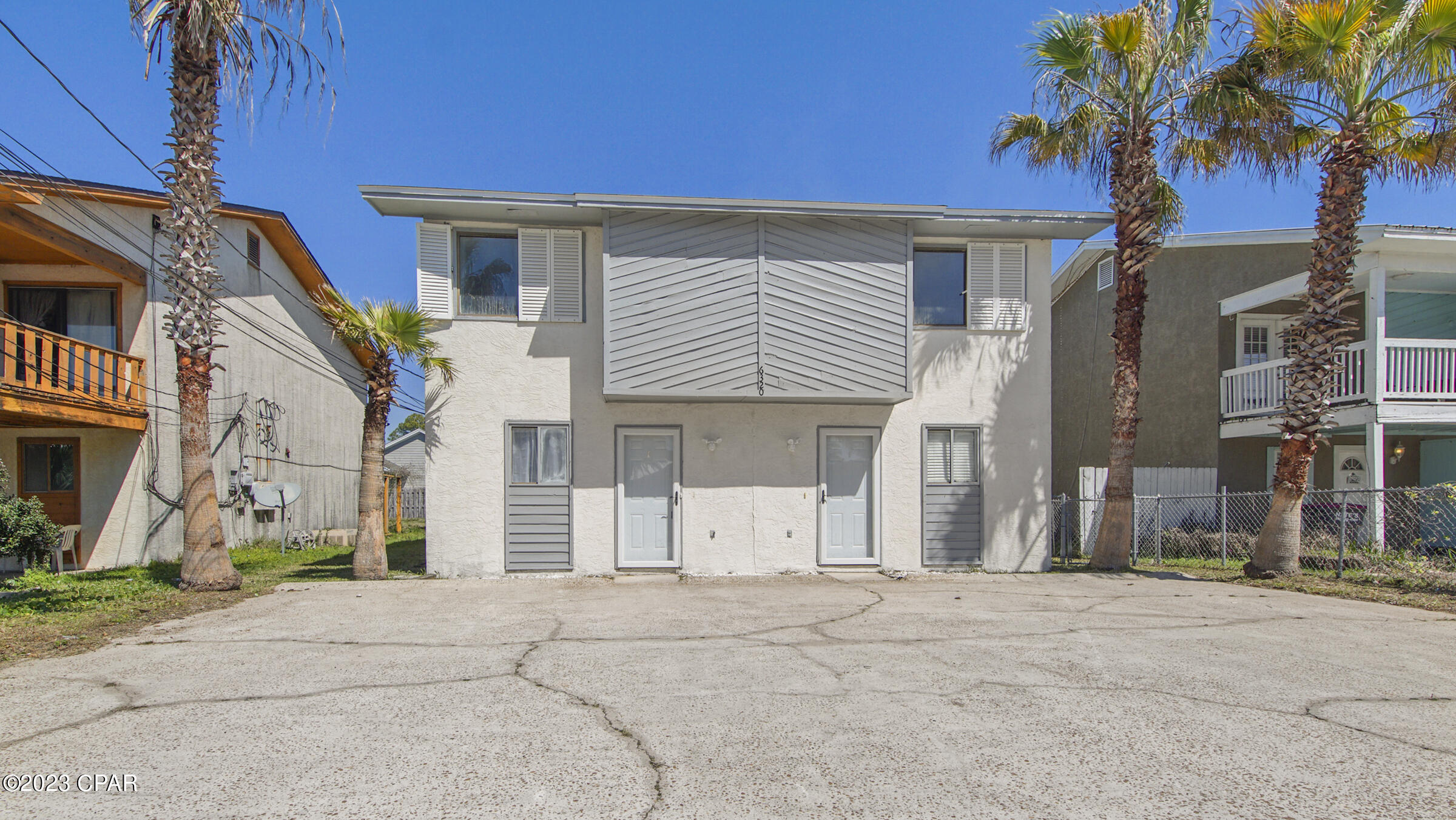 Have you been looking for an investment property or vacation home. Look no further. This is the place for you, located within walking distance to the beach! These two townhomes feature two bedrooms, one and a half bath each. Both units have new interior and exterior paint, new flooring, new cabinets and countertops in the kitchen and bathrooms. Outside you will find a newly refinished balconies with patio areas, individually gated backyards with bonus area. Storage room is perfect for owners closet. You will not want to miss this one!