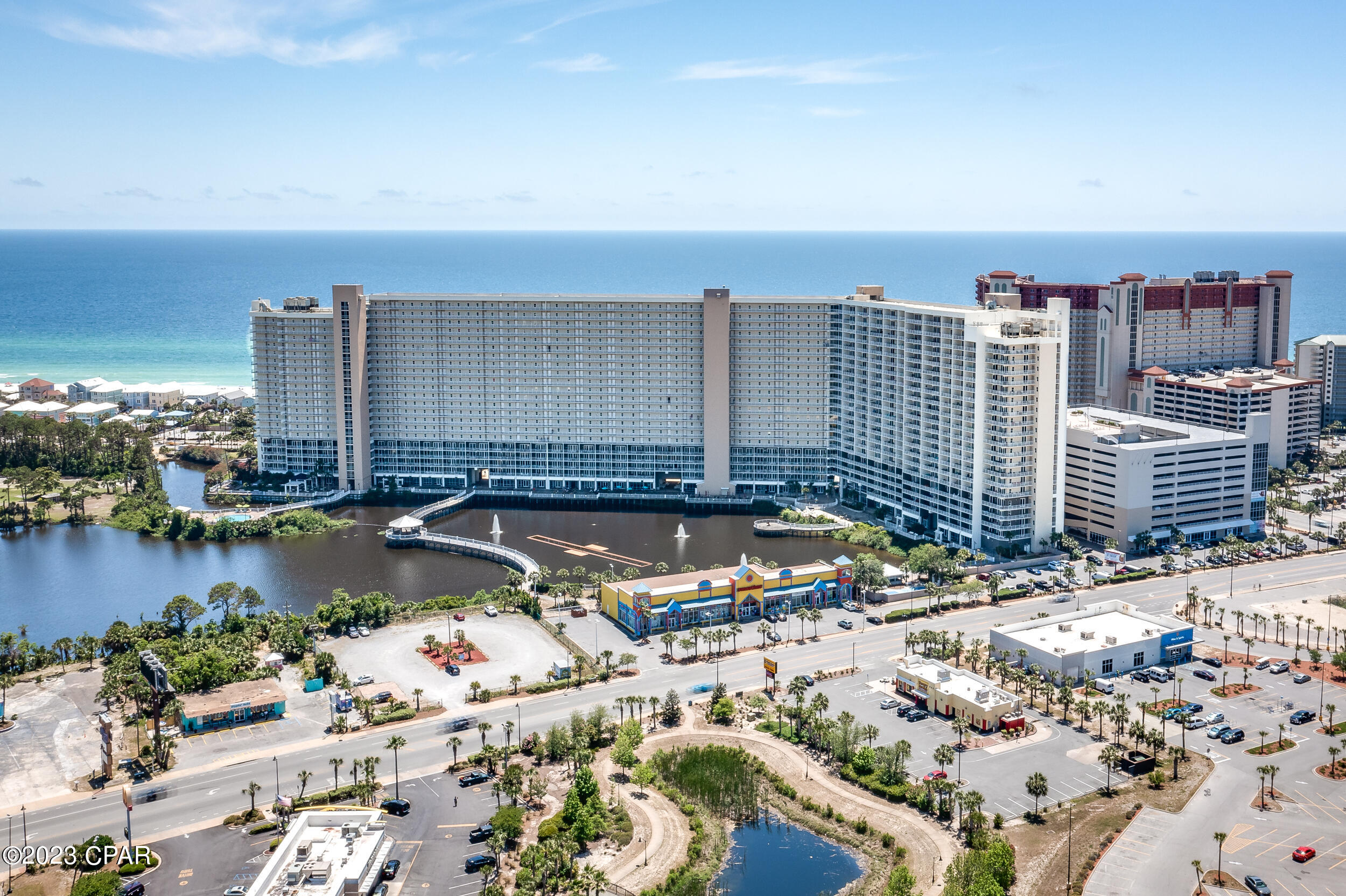 WOW!  Look at this price for a 3 bedroom / 2 Bath GULF VIEW unit at Laketown Wharf!!!!   The 5th floor is much desired in Laketown Wharf for the ability to park on the 5th floor of the garage and go straight to your condo without having to wait for the elevators.  This is a Three bedroom condo with a gulf view primary bedroom.  Upgraded LVP flooring in the bedrooms and living room, nicely furnished throughout and a rental favorite with it being a lower floor.  Everyone knows Laketown Wharf is THE place to be in PCB!  Watch the nightly lights and watershed outside your front door, or enjoy the sunsets on your balcony.  LTW amenities include 5 pools, playground, covered parking, events center, putting green, beach access, and lots of shops and restaurants in the commercial area.  Don't miss out on this great buy!