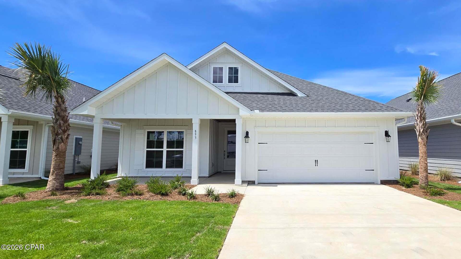 Welcome to 893 Crystal Bayou Boulevard, a new home at Breakfast Point East in Panama City Beach Florida. This home is ready for move in and features 2,300 square feet of naturally lit open living space and modern finishes. As you enter this home you will find a foyer with EVP flooring leading you past the first of three guest bedrooms and the guest bathroom. 

Continuing to the heart of the home, a large open concept living area awaits filled with natural light from the many windows and high ceilings. The kitchen has a center island and is open to the dining and living areas. Elegantly appointed, it is designed with quartz countertops, Herringbone tile backsplash, EVP flooring, and a single basin undermount sink in the island. Just off the kitchen, you'll find a secluded hall leading to the primary bedroom. An exceptional feature of this home includes a gas cooktop stove. 

Located in a private area of the home, this bedroom offers high ceilings and large windows. The luxurious primary bath is complete with an oversize tile shower, a dual sink vanity with quartz countertops, and a large walk-in closet with shelving. The laundry room is also conveniently located at the other end of the hallway. All three guest bedrooms can be found on the other side of the home along with the two full guest bathrooms. 

Beyond the interior features and details, every home is equipped with Smart Home Technology. This thoughtful integration of technology ensures that your new home is perfectly designed to meet the demands of modern life.