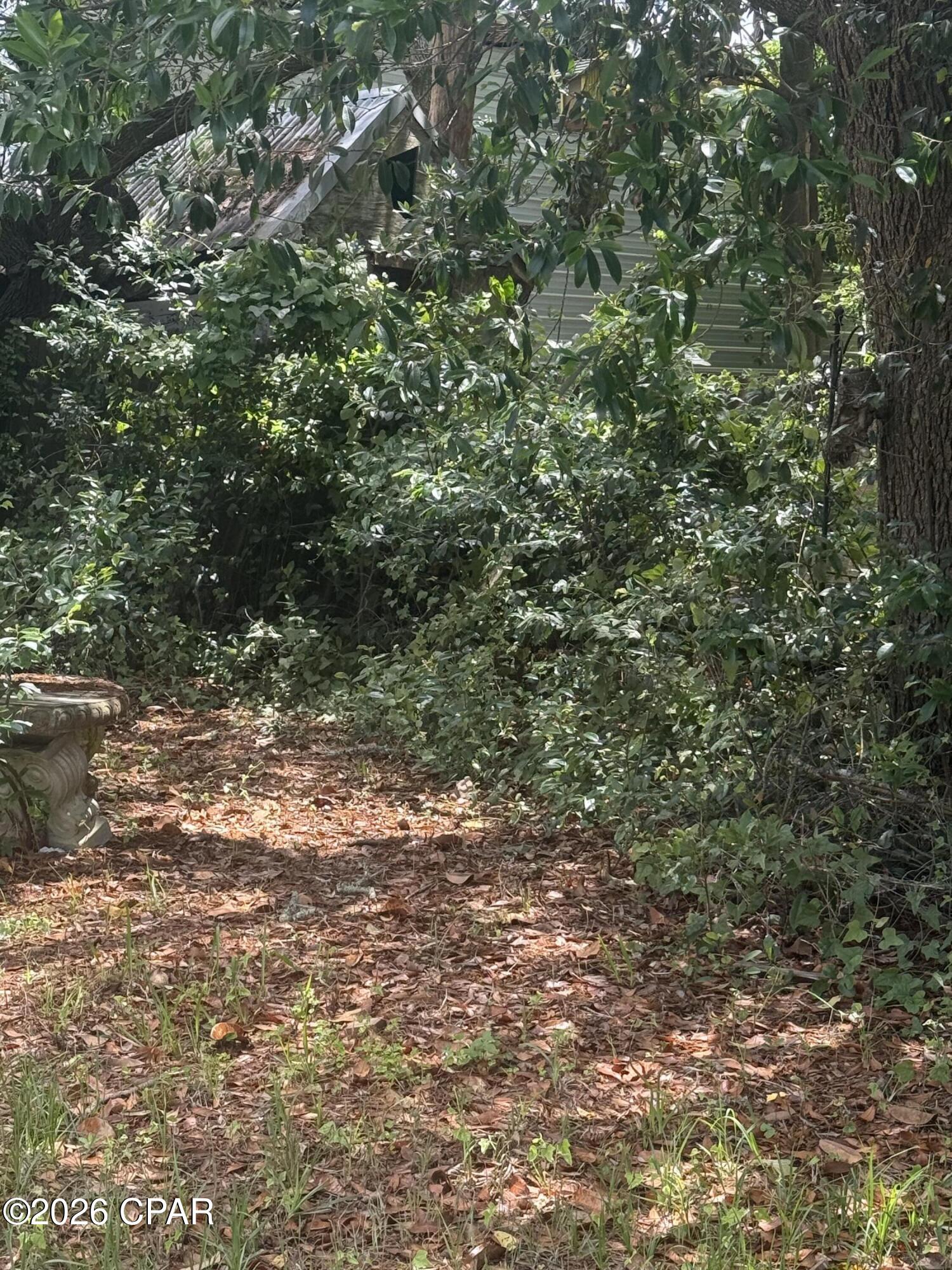 Opportunity awaits just blocks from the beach! Spacious 50x120 lot with access to sewer & gas, this property offers flexibility. Whether you are looking for an affordable beach getaway, rental investment, or future new construction site, this property delivers incredible potential just blocks away from the beach. Partially fenced lot with a shed.