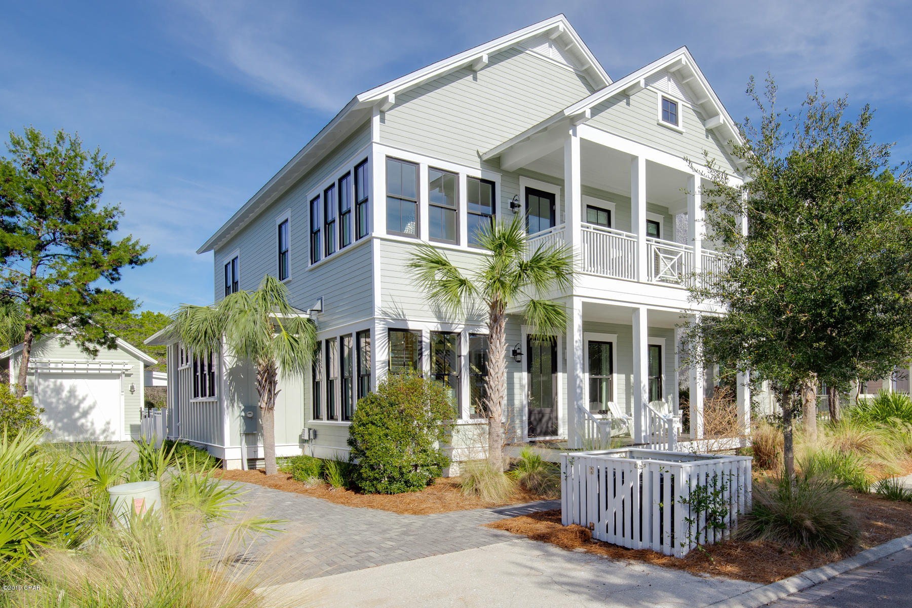 Amazing Sunlit beach home in WaterSound Beach. This custom designed home completed in 2014 offers craftsmanship features and designer furniture that rival any home in the area. From the moment you enter this home, you will notice custom trim and finishes throughout. Skillful mill-work, custom molding, doors and cabinetry are all displayed with tons of natural light from the plethora of windows throughout. The open floor plan flows seamlessly between the over sized kitchen and the great room with tabby fireplace, all leading out to the screened porch and your own private oasis in the back yard with heated pool and waterfall, fire pit, summer kitchen and outdoor dining. Perfect for large gatherings, family dinner or a quaint evening.