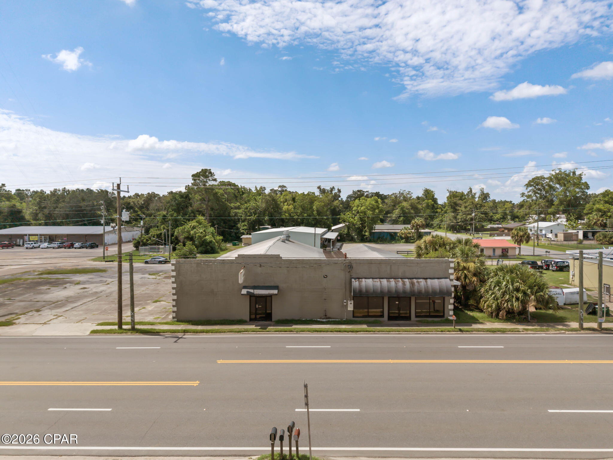 Bring your vision to life with this exceptional commercial opportunity in the heart of Chipley. Offering more than 7,000 square feet, this high-visibility building is ready for its next chapter. Interior demolition has already begun, giving the next owner a valuable head start while providing the flexibility to design the space to fit their unique business needs. Situated just off highly traveled Highway 90, the property features approximately 200 feet of highway frontage, providing outstanding exposure and easy accessibility. The expansive floor plan provides the flexibility to accommodate a wide range of commercial opportunities, allowing the next owner to customize the space to fit their vision. Located within the City of Chipley's Community Redevelopment Agency zone, the property could benefit from the area's ongoing focus on revitalization, reinvestment, and economic growth. An adjoining parking lot provides ample customer parking, making it well-suited for businesses that value convenience and accessibility. Located in the growing Chipley market with quick access to Interstate 10, Highway 231, and Highway 79, this is a rare opportunity to transform a well-positioned commercial property into a thriving business destination.