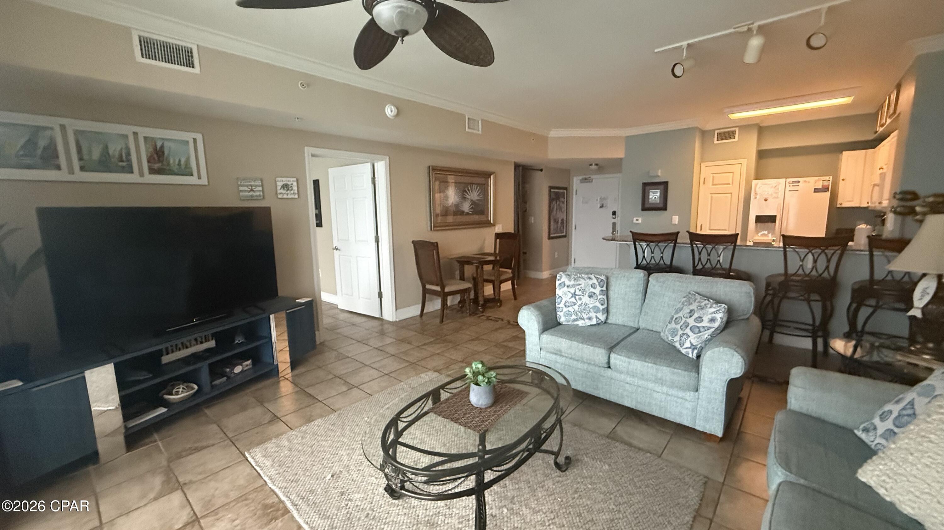Motivated seller and income producer. Beachfront master + bunk room, 2 full baths & deeded exterior storage! Tidewater 1312 features the highly desirable ''L'' floorplan with the master bedroom on the Gulf side and balcony access. Enjoy unobstructed Gulf views from the master, living area, kitchen, and balcony. The bunk room offers true privacy with a closable door. Sold fully furnished and turn-key, this condo has a strong rental history with the option to continue with the current rental manager. Located on 600+ feet of white-sand beach, Tidewater offers resort-style amenities including 2 lagoon pools with tiki bar, indoor heated pool, fitness center, spa, sauna, steam room, theater, restaurant, bar, game room, and more. Steps to Pier Park shopping, dining & entertainment.