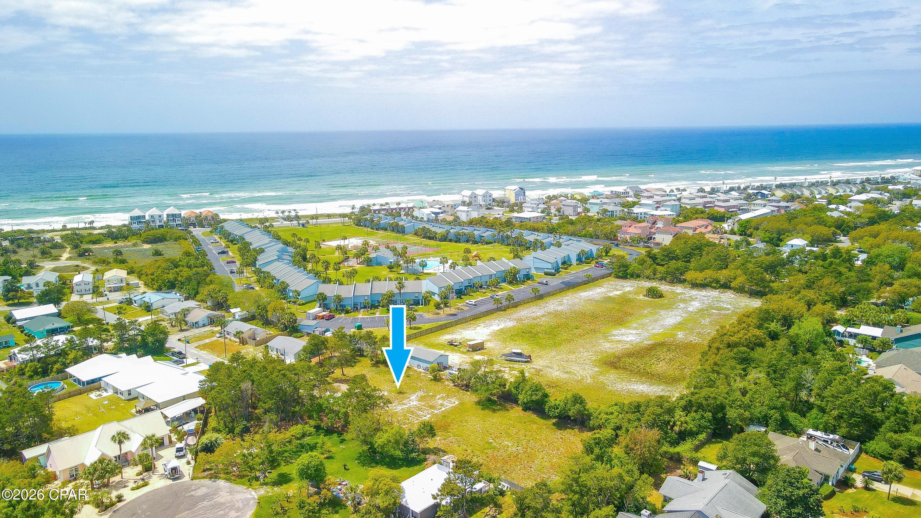 Here it is. Your coastal dream awaits. Discover the perfect setting to build your dream home on this expansive 30,000  
square foot (100 x 300) lot just 3 blocks from the Gulf of America. The largest lot in the area. This beautiful secluded lot is nestled on a dead end street in the peaceful well-established sought after Sunny side area. There are no HOA fees and flood insurance is not required. Septic recertified, water and electric all on the property. Don't miss your opportunity to own a piece of paradise. Your coastal dream awaits.