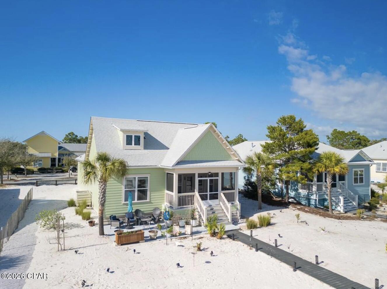 PROPERTY IS CURRENTLY UNDER CONTRACT. SELLER IS ACCEPTING BACK UP OFFERS. Tucked along one of Windmark Beach's most desirable boardwalks, 106 Salt Air Court, in Fisherman's Village, offers a seamless connection to the coast--where morning walks to the Gulf and evenings under open skies become part of everyday life. This single-level beach cottage is designed for ease, comfort, and the kind of relaxed luxury that defines Florida's Forgotten Coast. Positioned directly on a primary beach boardwalk, owners and guests enjoy a quick, effortless stroll to the shoreline just moments away. Equally appealing is the home's close proximity to the vibrant Windmark Beach Village Center, where a lagoon-style pool, dining, shops, and gathering spaces create a true coastal lifestyle experience. Built in 2018, the home features a thoughtfully designed layout with three well-sized bedrooms, two bathrooms, and a garage--ideal for both personal use and vacation rental potential. Luxury vinyl plank flooring runs throughout, offering durability with a refined coastal aesthetic. Outdoor living is just as inviting, with a screened porch overlooking the boardwalk--perfect for unwinding after a day on the beach--and an expansive paver patio designed for entertaining under the coastal sky. The recently replaced Trex boardwalk adds both value and peace of mind for years to come. Windmark Beach is known for its miles of waterfront trails, multiple beach access points, and a welcoming community atmosphere. Just a short drive away, Port St. Joe offers additional dining, shopping, marinas, and access to the pristine waters of St. Joseph Bay. Whether you're seeking a second home or a high-performing vacation rental, this property captures the ease, charm, and enduring appeal of life along the Gulf.