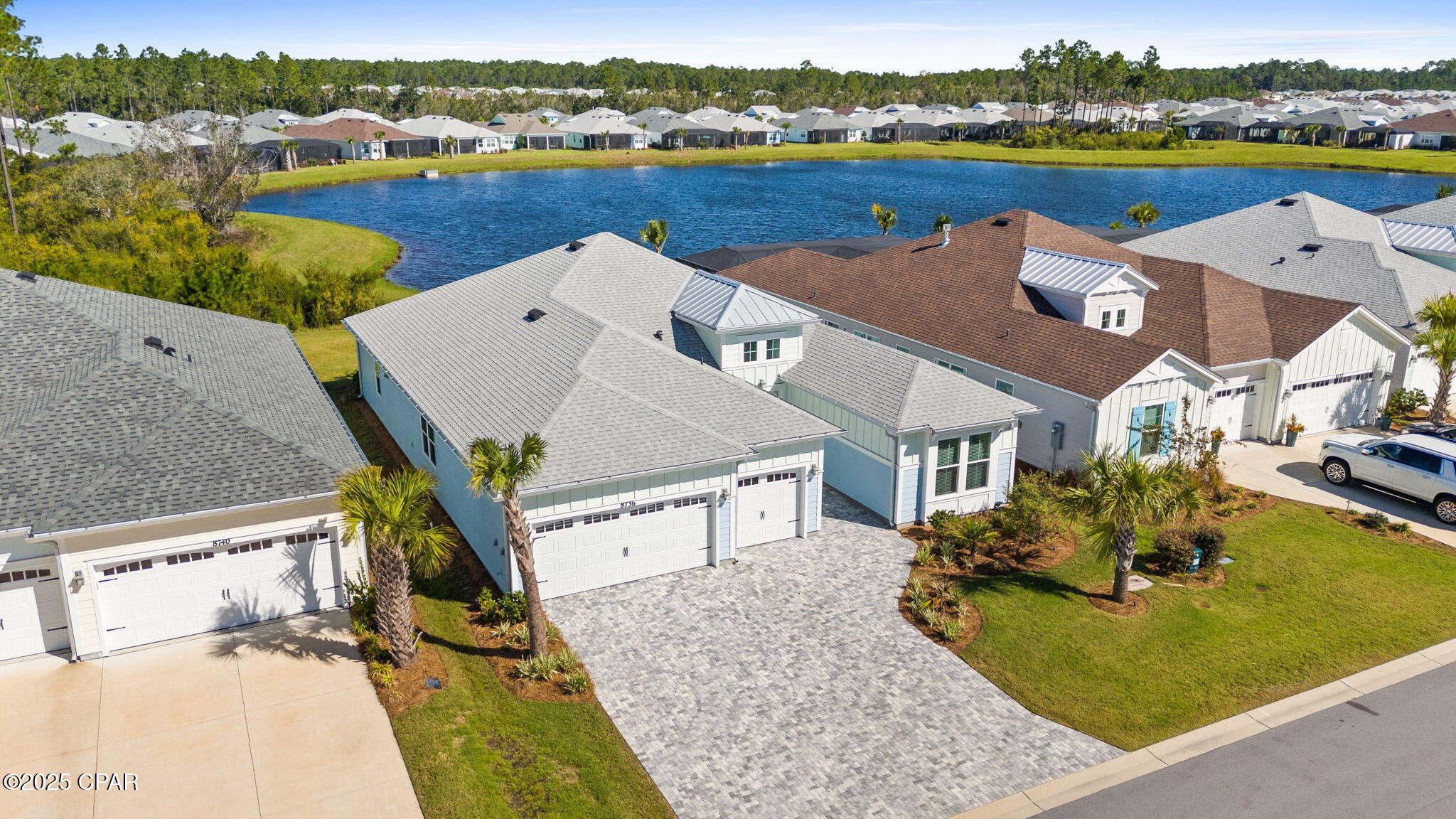 CURRENTLY UNDER CONTRACT, SELLER WILL CONSIDER BACKUP OFFERS.

RARE POND LOT! Close-in phase 4! Latitude Margaritaville Watersound, 55+ active lifestyle community! 7 miles from the BEACH!

Trinidad Bay - Island Collection | Pond & Preserve Views. Experience luxury coastal living in this HIGHLY UPGRADED, Trinidad Bay home perfectly positioned to capture tranquil pond and preserve views.
Highlights of the home include: 3 Bedrooms | 3.5 Baths | Den/Office | 3-Car Garage. Hurricane IMPACT WINDOWS,
Paver Driveway & Walkway | Quiet Island Collection Street.

Step inside the inviting open-concept floor plan featuring expansive light-filled living spaces, soaring ceilings, and sliding glass doors that open to a screened-in lanai with paver surround--ideal for relaxing or entertaining while enjoying peaceful nature views. The chef's kitchen is a showpiece with a gas cooktop, stainless appliances, wall oven and microwave, hood vent, upgraded cabinetry, and quartz countertops and backsplash for a seamless, high-end look. An oversized island and walk-in pantry make cooking and hosting effortless. The primary ensuite retreat overlooks the serene pond and features a Deluxe shower package with floor-to-ceiling tiled shower, frameless glass enclosure, overhead rain shower head-3 volume control valves, handheld shower w/slide bar, quartz countertops, and upgraded cabinetry. Two additional bedrooms each feature private ensuite baths with upgraded cabinetry, countertops, tile bathtubs and floors. A hall half bath for guest. The den/office offers flexibility, built-in cabinetry with a wet bar, and a wine cooler--perfect for work or entertaining. Throughout the home, enjoy Revwood by Mohawk laminate flooring, with plush carpet in the primary suite for added comfort. The spacious laundry room includes an abundance of cabinetry, granite countertops, sink, and washer/dryer.

Additional upgrades include screened covered, paver lanai overlooking the pond and preserve, landscape lights, custom electrical lighting for artwork throughout, tankless water heater with a internal circulating pump, 3 car garage, upgraded garage door openers with built-in cameras, garage insulation, attic storage, plumbed soft water loop and drain, exterior flood lights with motion sensors. Gas drops for dryer and on the exterior lanai. High/Low Cat6 dual outlets in the great room, den/office and primary suite. Pre-wired for a pool! Professional landscaping, driveway and walkway pavers for outstanding curb appeal.

This stunning Island Collection home embodies the Latitude Margaritaville lifestyle--where luxury, leisure, and location come together seamlessly.

Living in Latitude Margaritaville Watersound means embracing a true resort-style, active adult 55+ community, coastal lifestyle designed for fun and relaxation. At the heart of it all is the Town Square where live entertainment fills the air on a daily basis and every Fri/Sat. night! Homeowners enjoy: The Resort-style pools- perfect for lounging in the Florida sunshine or enjoying a swim with friends. State-of-the-art fitness center & group classes - including yoga, spin classes and lap pool and spa, water aerobics to name a few. Walking, biking, and golf cart trails that wind through the community with easy access to all amenities and a underpasses for safe and convenient access throughout the neighborhood. Sports courts - including pickleball, tennis, and bocce, basketball encouraging friendly competition and active living. Kayak launch for adventure seekers, Last Mango Theater for shows and events, ceramics and wood working shops, pet grooming and a dedicated dog park. Beyond the amenities, Latitude Margaritaville Watersound offers a low-maintenance lifestyle--with lawn care included in HOA dues, a 10 structural warranty, giving residents more time to enjoy the beach, boating, or exploring nearby Panama City Beach and 30A. Whether it's a sunset golf cart ride, cocktails by the pool, or mingling with neigh