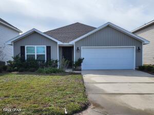 Move in Special of $200 off 1st Month Rent.  Spacious home offering  4 bed 2 bath 2 car garage with open floor plan available. Large master bedroom and bath with walk in closet and double vanity and walk in shower.  Kitchen is open with may cabinets and walk in pantry offer a center island open to dining & great room.  Covered patio in the rear with a private setting.  Located just 17 miles to Tyndall AFB and close to schools, shopping and easy commute to Panama City.  Small pets approved with refundable pet deposit  and monthly 50.00 fee.  Ready for the Holidays.