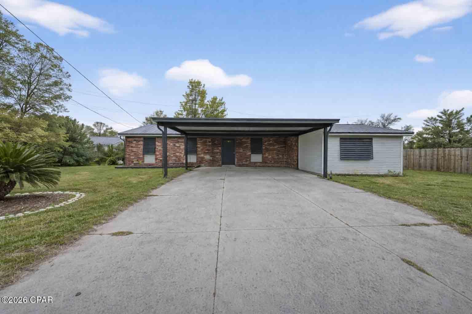 Well-maintained single-story brick home offering 3 bedrooms/2 bathrooms across 1,800 sq. ft. of living space. Interior features include wood flooring throughout. The kitchen is equipped with wood cabinetry, providing a lot of storage with its numerous cabinets, laminate countertops, stainless steel appliances, and a breakfast counter. A bonus room provides flexible space for a second living area, office, or hobby room. Bedrooms include reach-in closets, and the home also features a dedicated laundry area with built-in storage. The den is very large, and the master bedroom has a private bathroom. New double-pane windows complete the updates.

Situated on a 0.24 acre lot at the end of a quiet cul-de-sac, the property offers a spacious fenced backyard and a 2 car carport. The brick exterior and roof are well maintained. Conveniently located just steps from one of the Gulf Coast's top beaches, this home combines comfortable living with a desirable coastal location.