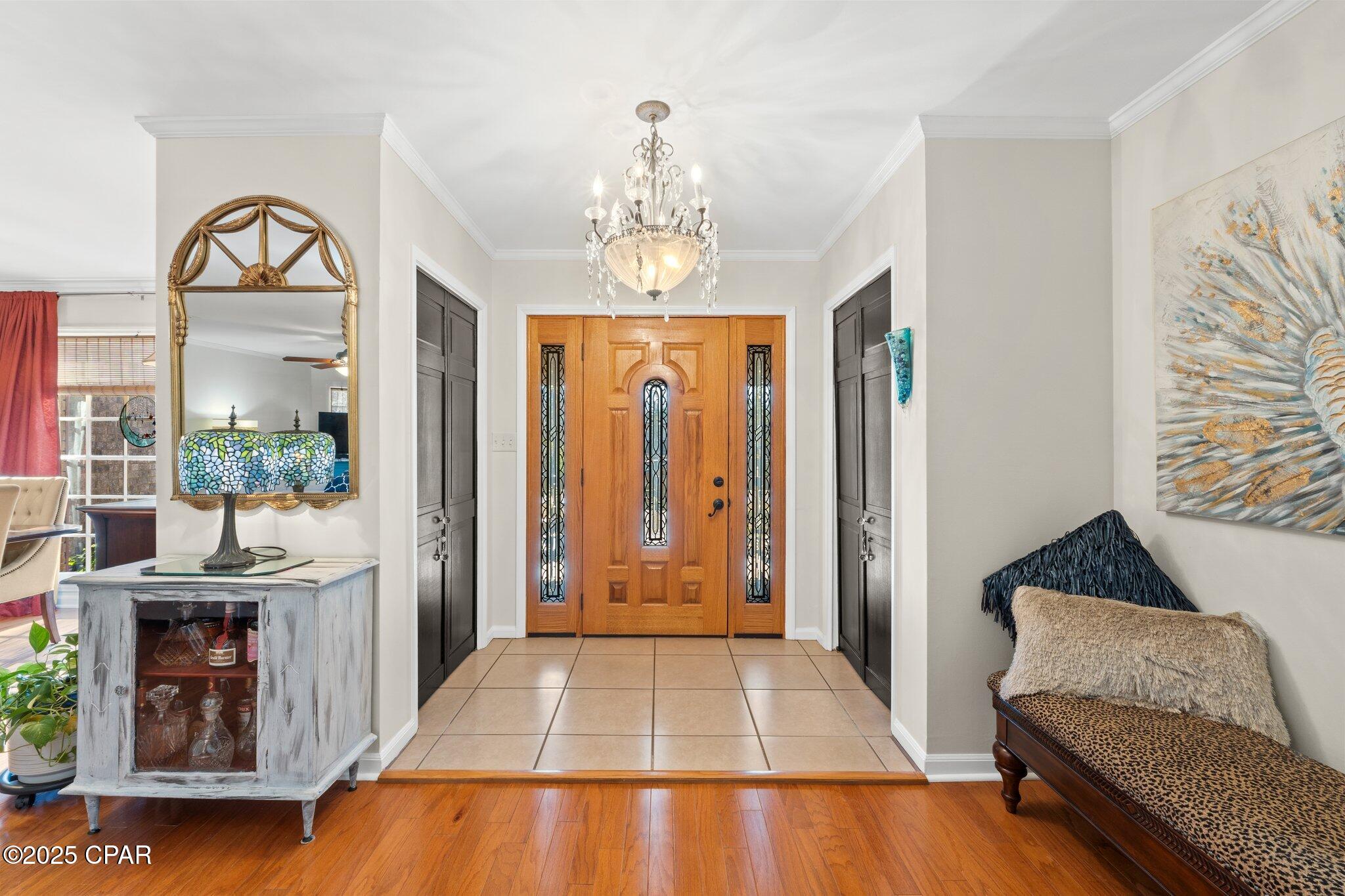 Welcome to this charming brick home in Chattahoochee, a true dream property that blends classic warmth with modern conveniences. Situated on a 0.77-acre lot, this 3-bedroom, 2.5-bath residence offers hardwood flooring throughout and plenty of inviting living spaces. The eat-in kitchen is a chef's delight, featuring an island, abundant cabinetry, modern appliances, and a commercial-sized freezer/refrigerator. Two oversized gas fireplaces create cozy focal points within the home, while the expansive primary suite impresses with an ensuite bath and dressing room. Each bedroom includes large double closets, providing ample storage. The oversized 2-car garage has been converted into a heated and cooled bonus room, adding even more flexibility for living or entertaining. Outdoor amenities abound, including an attached 2-car carport, an RV-sized pole barn, a pre-wired shed, and a 50-amp 4-prong receptacle. The fully fenced backyard boasts a stunning multi-level oversized deck, perfect for gatherings or simply enjoying the serene setting. With its combination of comfort, functionality, and thoughtful updates, this home is ready to welcome its next owners.