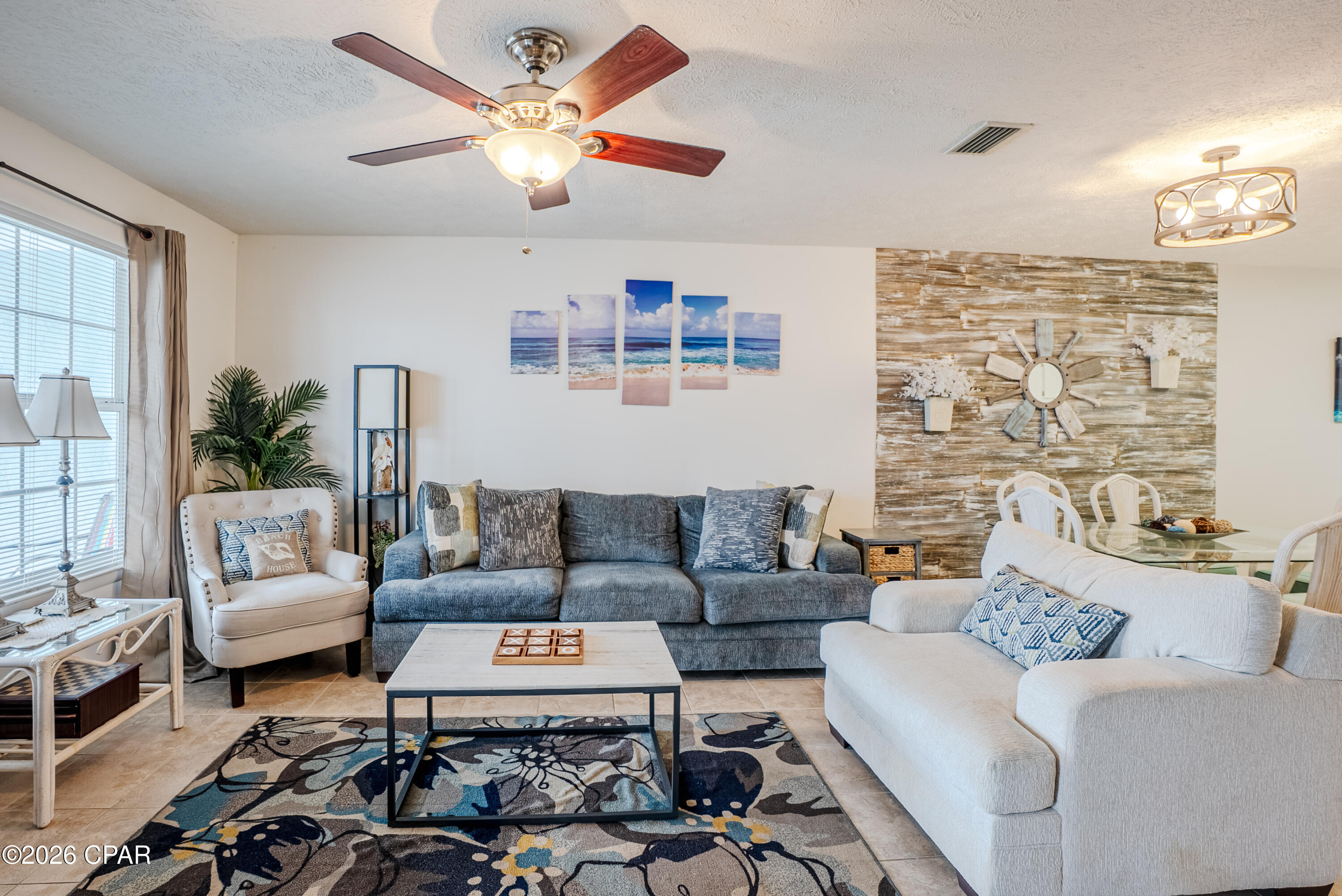 **Great Price Adjustment** Welcome to the World's Most Beautiful Beaches!!This beautifully maintained 2-bedroom, 2-bath coastal retreat features an open-concept floor plan designed for relaxed beach living. The kitchen offers very nice finishes and flows seamlessly into the living and dining areas, creating an inviting space for entertaining or everyday use. Unique wall décor adds character and a distinct coastal charm throughout the home.
Enjoy mornings and evenings on the covered porch, perfect for unwinding after a day at the beach. Located just a short stroll from the sugar-white sands of Panama City Beach, this property is ideally positioned near Pier Park, popular dining spots, and entertainment. Situated in the highly sought-after West End, this home provides close proximity to 30A lifestyle amenities--without the 30A price tag.
Whether you are seeking a short-term rental investment or a personal beach getaway, this property offers versatility, location, and strong appeal in a proven rental market. Condo is being sold furnished (with the exception of blue sofa, white over sized chair, guitar and items over sink). New water heater 2024, new garbage disposal 2025, new electrical panel 2023.
 HVAC serviced 4/6/2026. HOA includes water, trash, exteriorinsurance,flood insurance, sewer and internet/cable. Sellers have a one year home warranty  on condo.  Call your agent today to see this great unit.