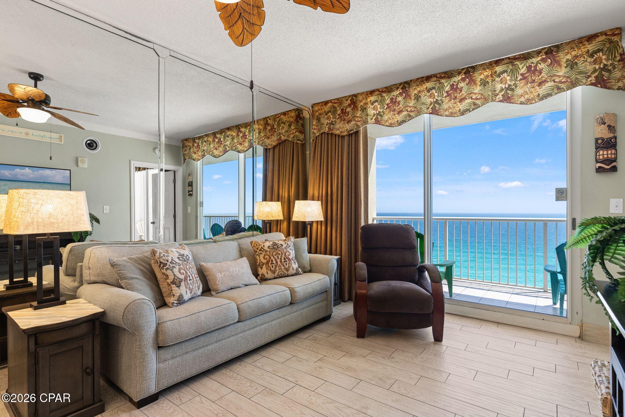 Welcome to Majestic Beach Towers #2-1305 -- a beautifully upgraded, fully furnished Gulf-front condo with strong rental history and stunning resort amenities. This spacious unit features wide white tile plank flooring and matching tile baseboards throughout ($15,000 upgrade), a tiled Gulf-front balcony, upgraded Corian countertops, white ceramic sinks, designer faucets, wine cooler, electric fireplace, and elegant floor-to-ceiling mirrors in the den and primary bedroom.
Recent updates include solar insulation window film on balcony doors/windows (2025), new water heater (2025), new microwave (2025), Nest thermostat, and Ring doorbell. 
Owners and guests enjoy five pools, hot tubs, fitness center, tennis and pickleball courts, movie theater, on-site dining, covered parking, 24/7 security, and 650 feet of direct beach access at Majestic Beach Towers. The HOA is fully funded with no history of special assessments and is considered one of the best-managed on the beach.
Conveniently located near shopping, dining, and entertainment, this condo is ideal as a vacation rental, full-time residence, or personal beachfront retreat.