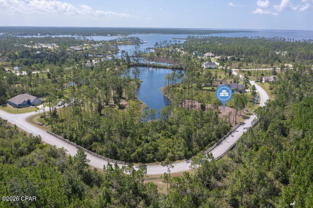 Discover the perfect setting to bring your dream home to life in the prestigious gated waterfront community of Laird Point. This cleared homesite is ready for your vision, saving you valuable time and preparation costs while offering an exceptional location surrounded by nature.

Enjoy direct access to the lake, where peaceful mornings can begin with kayaking or fishing and evenings can end with breathtaking waterfront sunsets. The community's underground utilities preserve the natural beauty of the neighborhood, while the gated entrance provides added privacy and security.

Conveniently located just minutes from Tyndall Air Force Base, as well as shopping, dining, and everyday conveniences, Laird Point offers the ideal balance of quiet coastal living and modern accessibility.

Whether you're designing your forever home, a second residence, or an investment in one of the area's growing waterfront communities, this property presents an outstanding opportunity. Experience the lifestyle you've been looking for and see why Laird Point continues to attract homeowners seeking both serenity and convenience.

Contact me today for additional information or to schedule your private tour.
