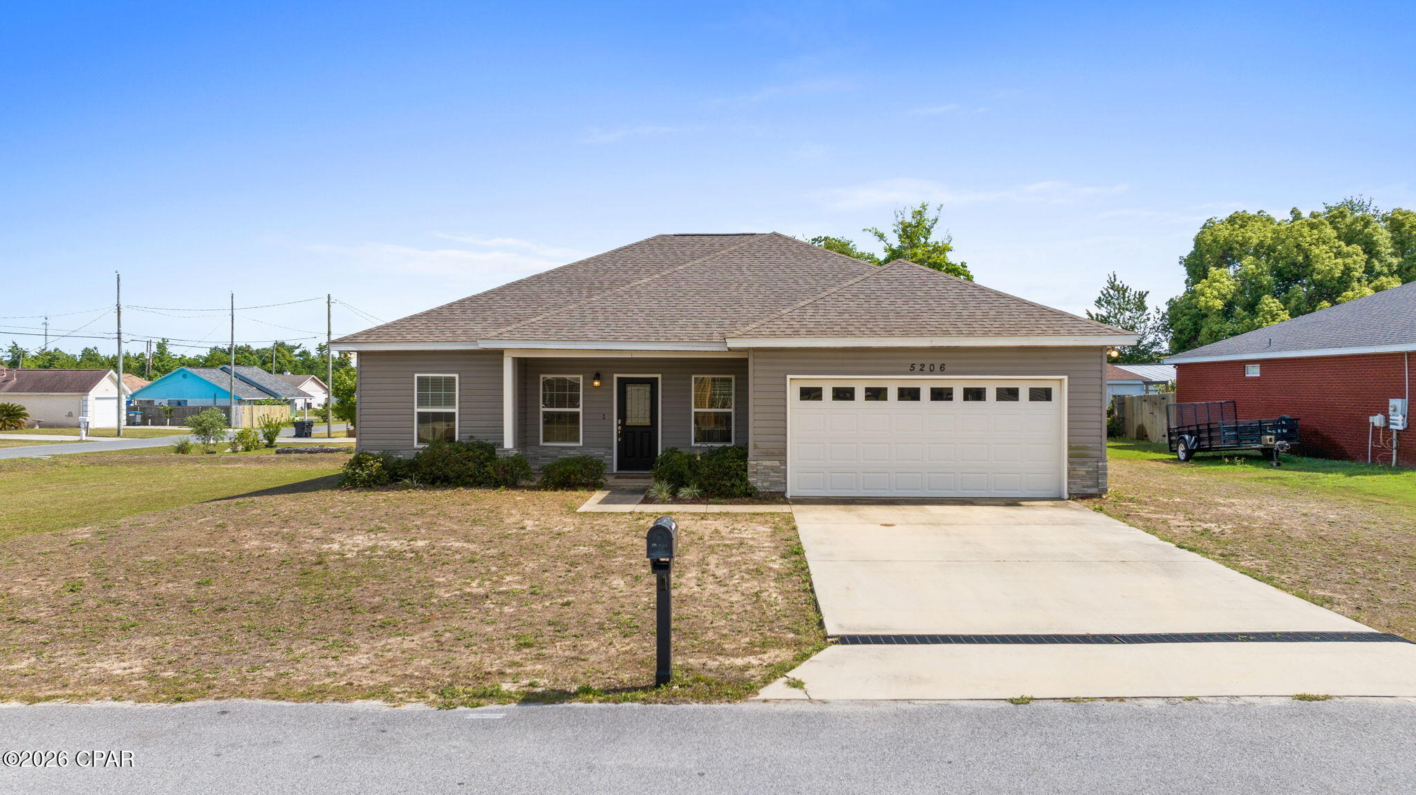 Built in 2020, this stunning home combines modern style with a warm, inviting presence. On a corner lot in a nice and quiet cul-de-sac. Open concept floorplan.. This kitchen boasts beautiful custom cabinetry, stainless steel appliances and a spacious island with breakfast bar. Dining space right next to kitchen. Sizable master suite with 9ft ceilings. En-suite offers a double vanity and an oversized walk-in closet. Split floor plan gives additional privacy to master suite. Both guest rooms are generously sized and feature spacious closets. Privacy fenced backyard with covered patio. The 2-car garage features a lifetime epoxy flooring and fold out workbench. Fantastic proximity to Tyndall Air Force Base, just 3.7 miles away. Also just a short drive to Mexico Beach and 10 minutes to Downtown Panama City! Must pass credit and background check. Pets ok but breed restrictive. Schedule your visit today!