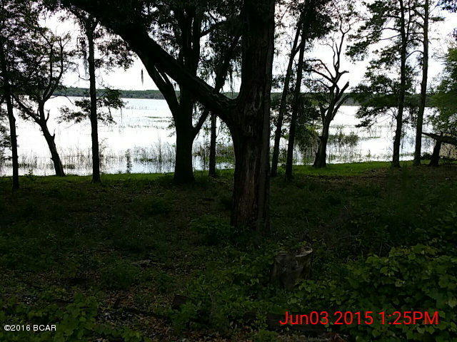 Waterfront lot on Hicks Lake Trail for only $24,900. Perfect getaway property! Hicks Lake is a 365 acre spring-fed lake in South Washington County. Property has a well, septic tank, and two portable buildings - one is 20x24 and one is 12X12 - already on the property. Also has a two-car detached carport. Located approximately 35 miles to the International Airport and to the World's Most Beautiful Beaches of Panama City Beach.