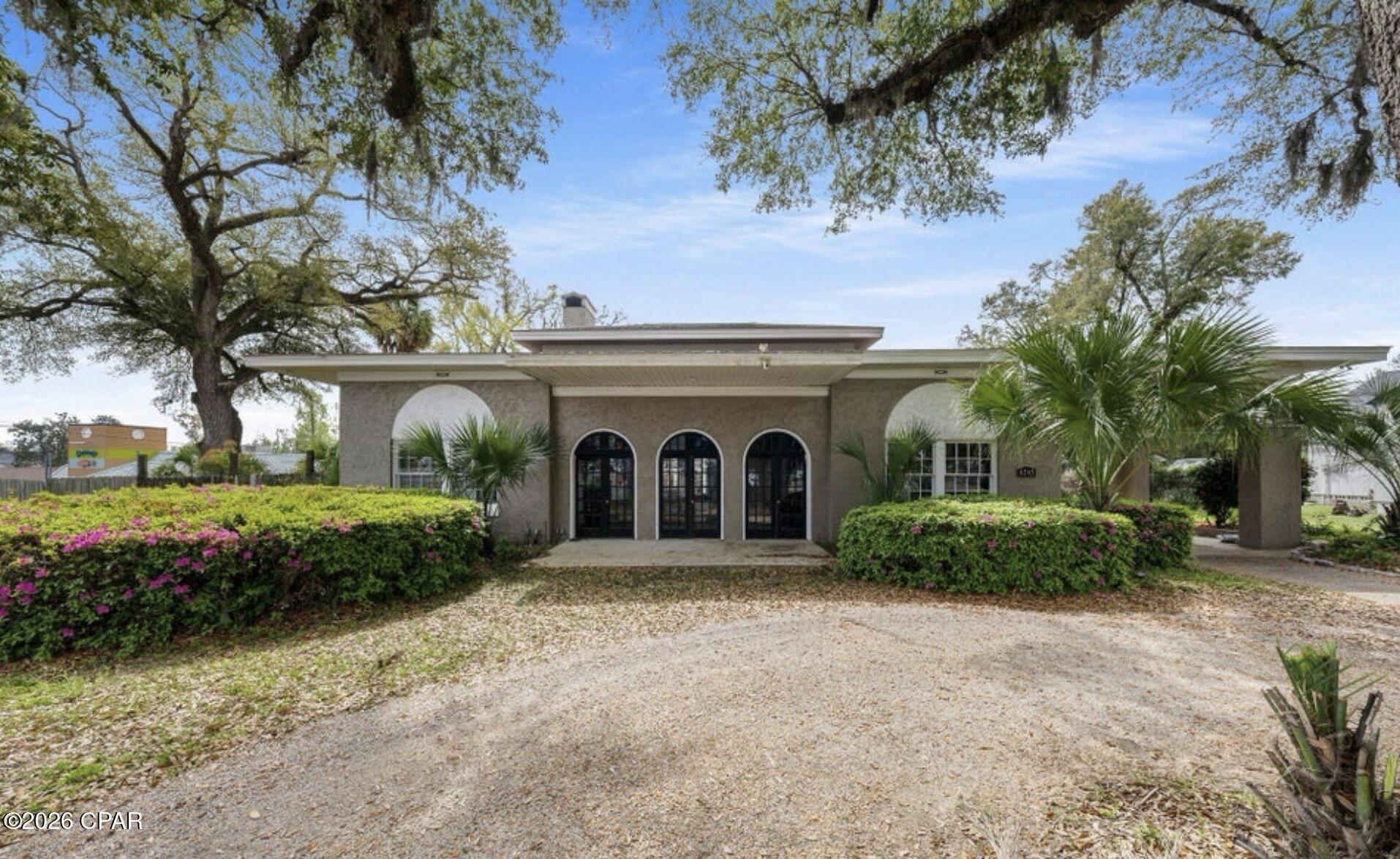 Steeped in charm and history, this beautifully preserved home at 4245 Lafayette Street in historic Marianna, Florida offers a rare combination of authentic character and modern versatility. Carefully maintained to stay true to its original design, the home features period correct details, original craftsmanship, and tasteful updates that bring comfort and functionality into the present day. Ideally situated in a prime commercial corridor, this property's mixed use zoning makes it a standout opportunity for entrepreneurs, professionals, or creative individuals seeking a live work environment. Imagine operating your business from the spacious front professional area of the home with a panoramic view of Highway 90, while enjoying private living quarters in the back of the home, which can be closed off from the front office or converting the property into an inviting boutique, office, or niche flower shop with plenty of space in the back yard to plant and grow your own flowers. With its prominent street frontage, timeless curb appeal, and updates that respect its heritage, this property offers both historic elegance and modern potential. A true Marianna landmark, 4245 Lafayette Street is perfect for those who appreciate history, style, and smart flexibility in one exceptional address.