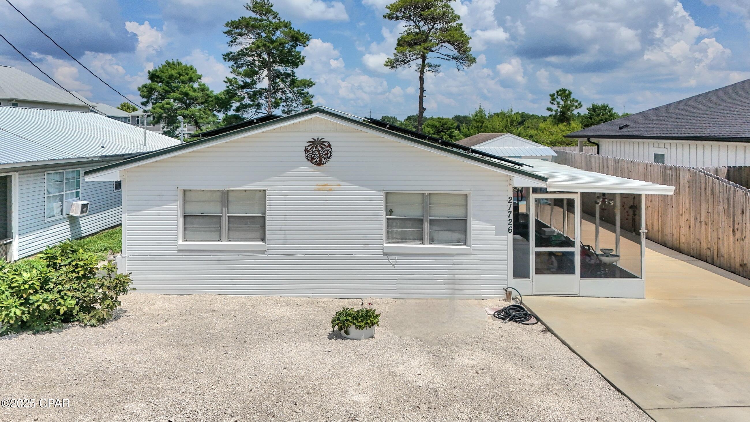 PRICE IMPROVEMENT! SELLERS ARE READY TO SELL!
Charming Beach Cottage + Income-Producing ADU - Less than ½ Mile to the Beach! House has Solar panels that will be paid off. Power bill runs under $30 every month.

Located on the desirable West End of Panama City Beach, this unique property offers versatility, charm, and income potential—just a short walk or golf cart ride to the Gulf!

The main home (780 sf) features 2 bedrooms and 1 full bath, full of beach cottage character and equipped with a newer HVAC. Out back, a separate studio (308 sf), 1 bath Studio apartment with kitchenette and private entrance is currently a successful income-producing rental—perfect for guests, tenants, or extra space!

Enjoy a spacious backyard ready for entertaining, complete with fruit trees, a large new shed, and a smaller shed with washer/dryer.

Live in one and rent the other, rent both, or keep both for yourself—the OPTIONS are endless. With its unbeatable location, dual living spaces, and strong rental potential, this is a rare find on the West End!