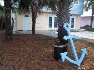 This Beautifully Updated Beach Home is Just Two Blocks From The Beach On The Desirable West End! This is the one that you have been waiting for! A Lovely 3 Bedroom, 2 Full Bath Beach House that can be easily converted to have a Lockout(separate apartment to rent). Metal Roof! Granite Countertops with stainless steel appliances, including a 5 burner gas range with a convection self cleaning oven,refrigerator with LCD lighting, wave action microwave. Enjoy your meals outside through the French doors, to the covered top deck or listen to the surf while swinging in your hammock. Upper and Lower decks with Trex Boarding! Home has a reverse osmosis water filtration system.The layout is perfect for Full Time, Vacation Home or as a income generating rental. The lower level has tile floors