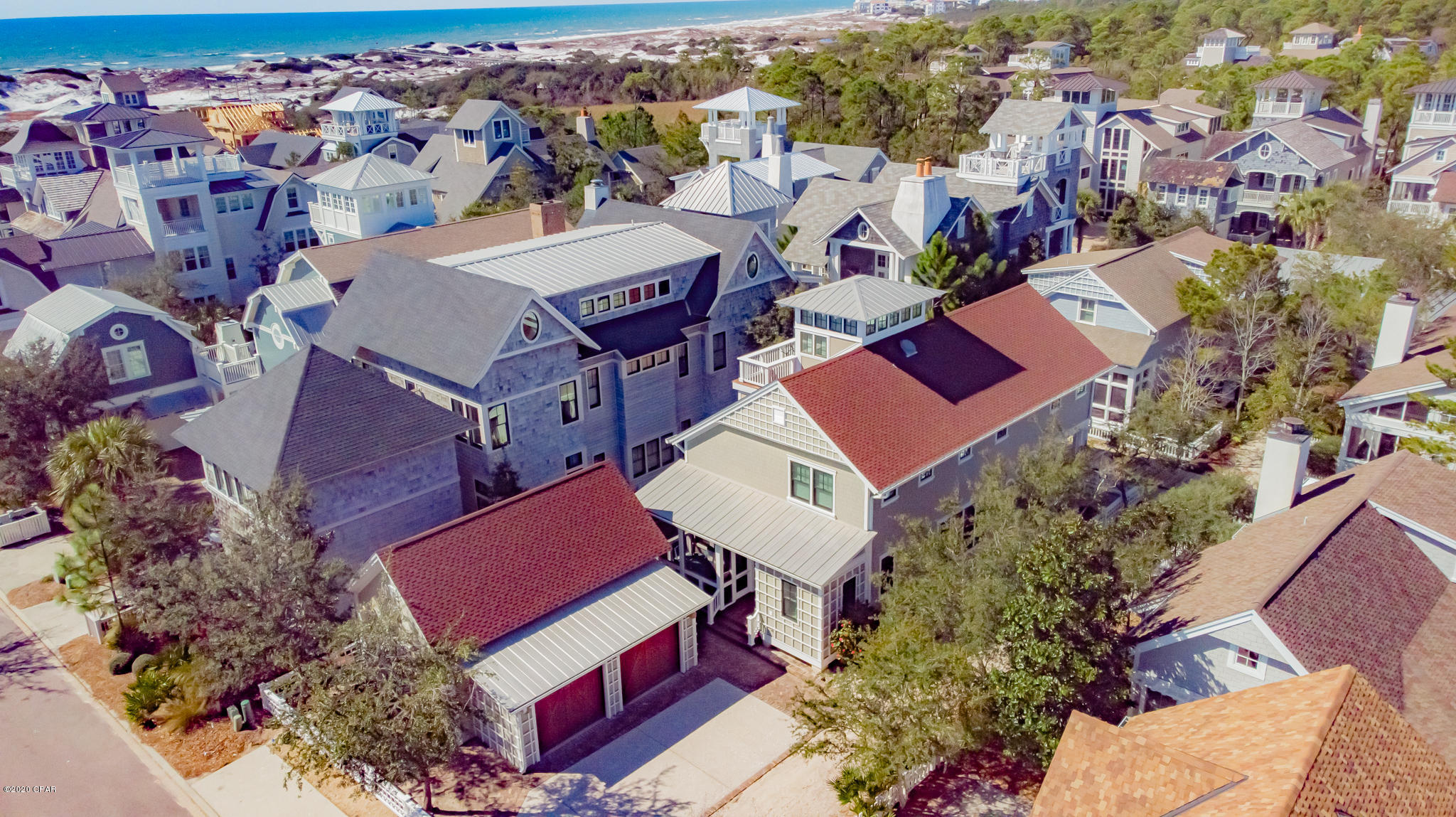 Seller entertaining all reasonable offers. 

 Revel in this fully furnished, turn-key, 4 Bedroom, 4.5 Bath masterpiece and embrace the lifestyle you have always dreamed of living in Watersound Beach!  This beautifully decorated luxury home offers a fabulous kitchen with a gas jenn air stove, center island and lots of cabinets, large spacious living room with fireplace, dining room, and master suite on main level.  Second level offers three chic bedrooms with private baths and a sitting area.  A third level level provides an entertaining bar and a balcony.  Extra features include large storage room, 20x9.6 screened porch,18.9x9.6 covered porch hardwood and marble floors, plantation shutters very good size laundry and a 3 car garage. This home is very CLOSE to the BEACH and waiting for you to enjoy.