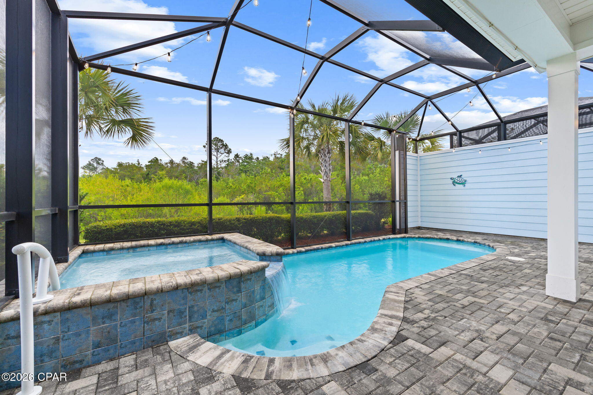 BARBUDA BAY! POOL!  HOT TUB!  LOCATION!  What more could you ask for?  Welcome to Margaritaville Watersound.  The Barbuda Bay is one the most desirable and sought after floor plans.  Ideally located just 3 minutes to the town square and its world class resort style amenities with convenient access to the mailboxes and the Barkaritaville Dog park.  This beautifully appointed Barbuda Bay villa blends coastal style with easy Florida living.  Inside you'll appreciate thoughtful upgrades such as plantation shutters, staggered six by thirty-six inch tile flooring throughout, crown molding, eight-foot doors, and five and a quarter inch baseboards. The kitchen shines with quartz countertops, a herringbone tile backsplash, forty-two inch cabinets, and a double oven.  Great for entertaining!  Ceiling fans and dimmer switches add comfort throughout as well.  Both bathrooms are finished with floor to ceiling tile and have granite countertops for a luxurious touch. The laundry room includes a utility sink and added extra cabinetry for even more storage.   Step outside to your private oasis featuring a sparkling pool and relaxing hot tub.  All under an extended lanai with pavers.  The pool can be heated during the cooler months for your year round water filtration system and a garage with insulated walls and epoxy flooring.  Driveway pavers is yet another upgrade adding even more value to the villa.  The HOA covers lawn care, exterior painting, and roof replacement as needed providing low maintenance living so you can truly enjoy a carefree lifestyle.  This vibrant 55 plus community offers endless activities so there's always something to enjoy.  The amenities include a state-of-the art fitness center with indoor lap pool and hot tub, resort style pool with zero entry, pickle ball, bocce ball, tennis, basketball, walking trails, dog park, the popular Bar & Chill restaurant overlooking the Intracoastal waterway, as well as a full calendar of clubs, concerts, and social events.  Don't forget the kayak launch.  Perfect for exploring the waterway.  The town center has a ceramic shop, theater, meeting rooms, wood working shop, and there is an events calendar constantly adding new events for your entertainment.  Live music daily by the pool and at the Town Square on the weekends.  Completion date for the new Publix grocery store is '27.  A future marina will be just off Latitude Blvd.  The newly opened medical center is 3 miles away with a planned hospital to open 2027.  Located just 7 miles from the Gulf Coast's world famous sugar white beaches, Margaritaville Watersound has it all!  Discover why this beautiful Barbuda Bay villa is the perfect place to call home.