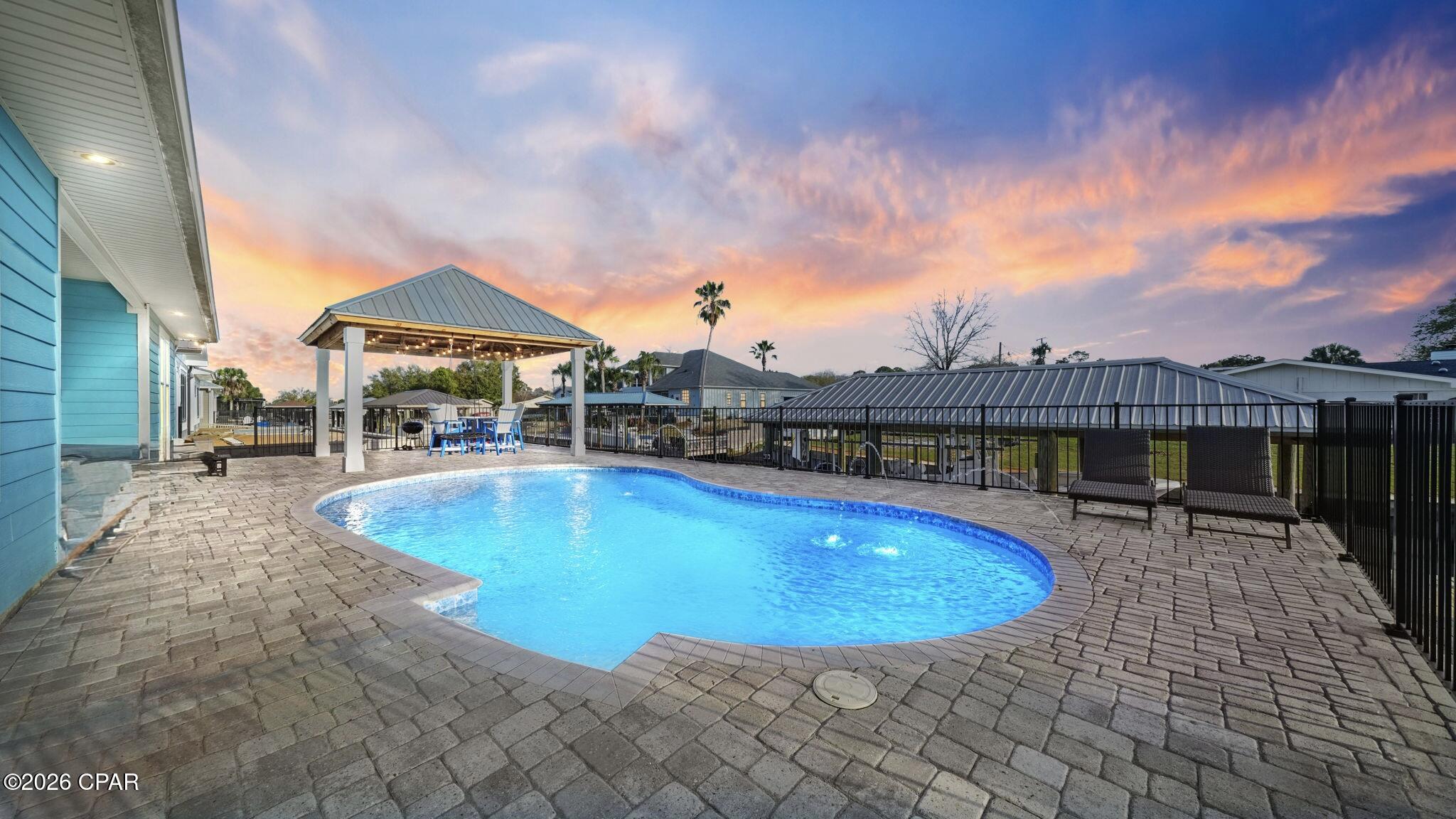 Back on the market no fault of Sellers

Fully furnished, 
Indoor and outdoor furniture, plus the hot tub included!!
Your Private Dock Awaits.
Ultimate Boating Paradise in Gated Dolphin Bay! 
Imagine stepping out your back door to direct canal access on St. Andrews Bay with your own private dock and boat lift--ready for endless days of fishing, cruising, and Gulf adventures! This jaw-dropping 5-bedroom, 3-bath, ~2,775 sq ft contemporary stunner (built 2019) delivers coastal luxury at its finest: soaring open-concept living spaces, premium high-end finishes, and a show-stopping dedicated home theater perfect for epic movie nights or game-day blowouts.
Nestled in the heart of Panama City Beach's hottest gated community, you're minutes from sugar-white Gulf beaches, world-class dining, shopping, and endless entertainment. Whether it's your forever dream home, a sought-after vacation escape, or a high-potential investment property, this rare gem screams ''Florida coastal living done right.'' Don't wait--opportunities like this vanish fast! Schedule your private tour today and make it yours.