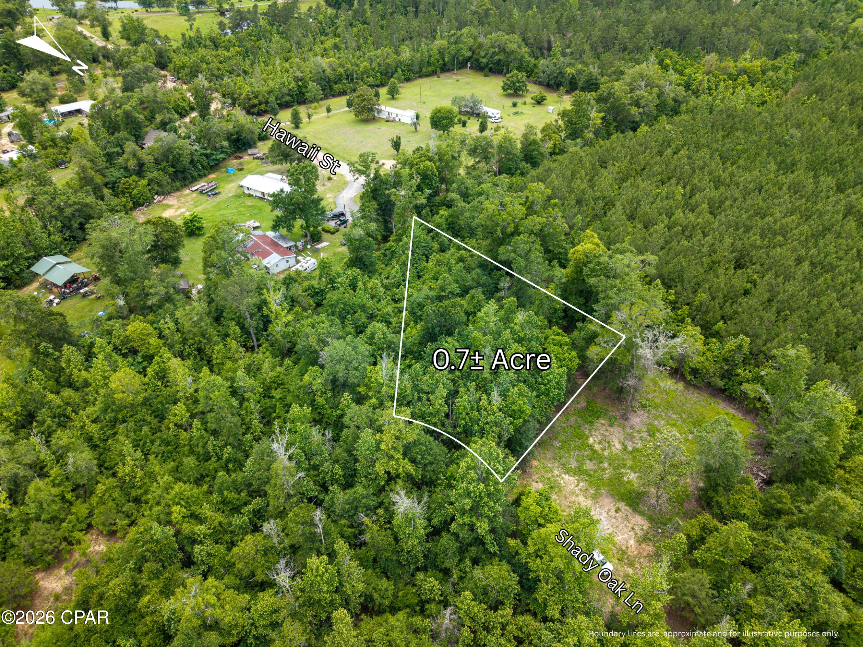 0.7± acre, undeveloped lot on Shady Oak Ln in Alford, FL. Power nearby, will need well and septic.