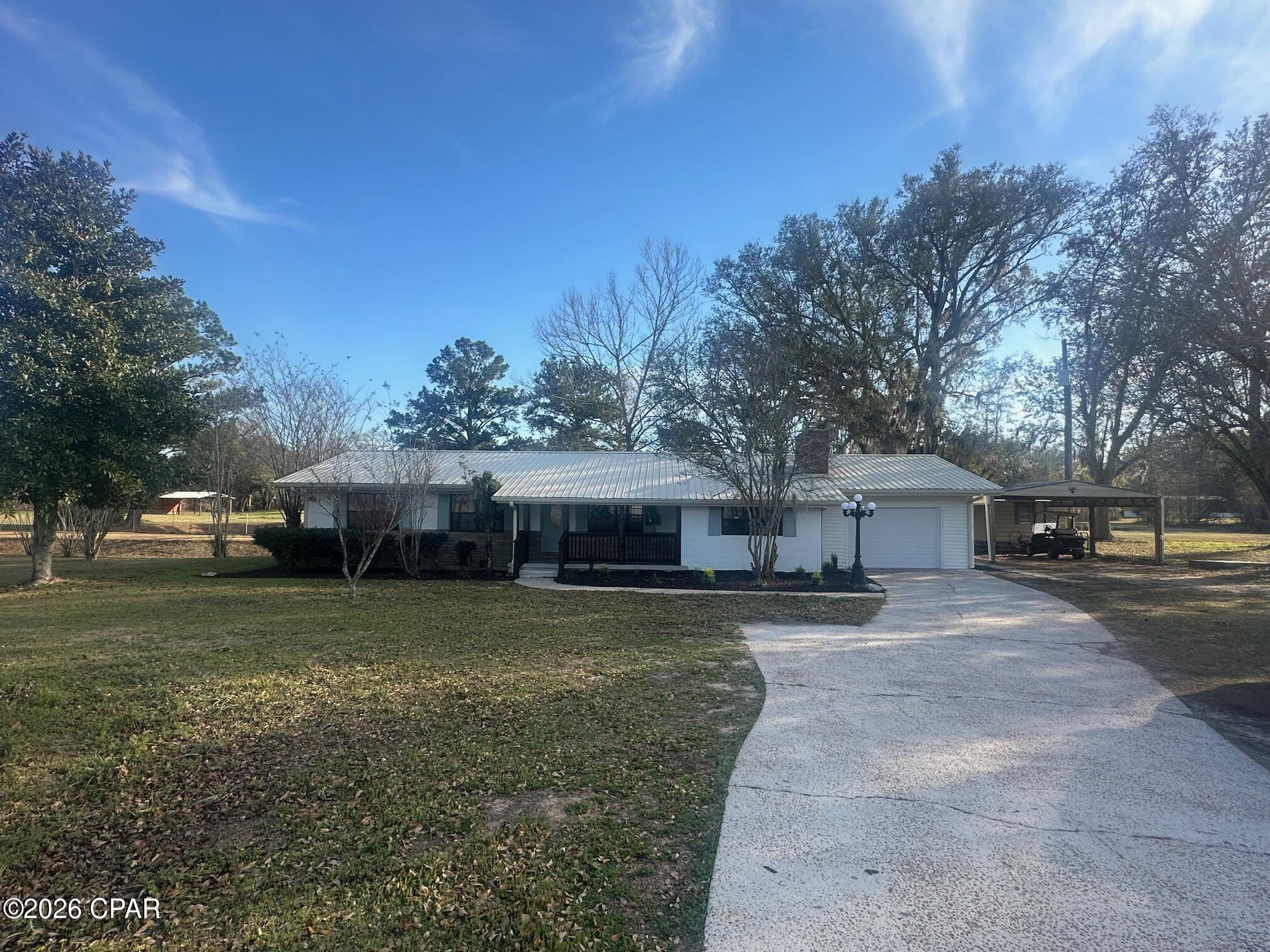 This meticulously remodeled home with a fishpond, woods, storage sheds and more is calling your name!!  We can't wait for you to see the new kitchen with grant counter tops, new cabinets, flooring and the like.   Speaking of flooring, all new flooring throughout the home.  The bathrooms, wait until you see the bathrooms with a marble looking tile and new fixtures.    New hot water heater, and so on.   When you walk outside, there are plenty of storage buildings and land.  Even with the current water table low in the region, there is still a good level of water in the main fishpond.   There is a great stock of trees in the woods in the back.  Beautiful oak trees abound the property.   Call today to make your appointment to see this beautiful property.