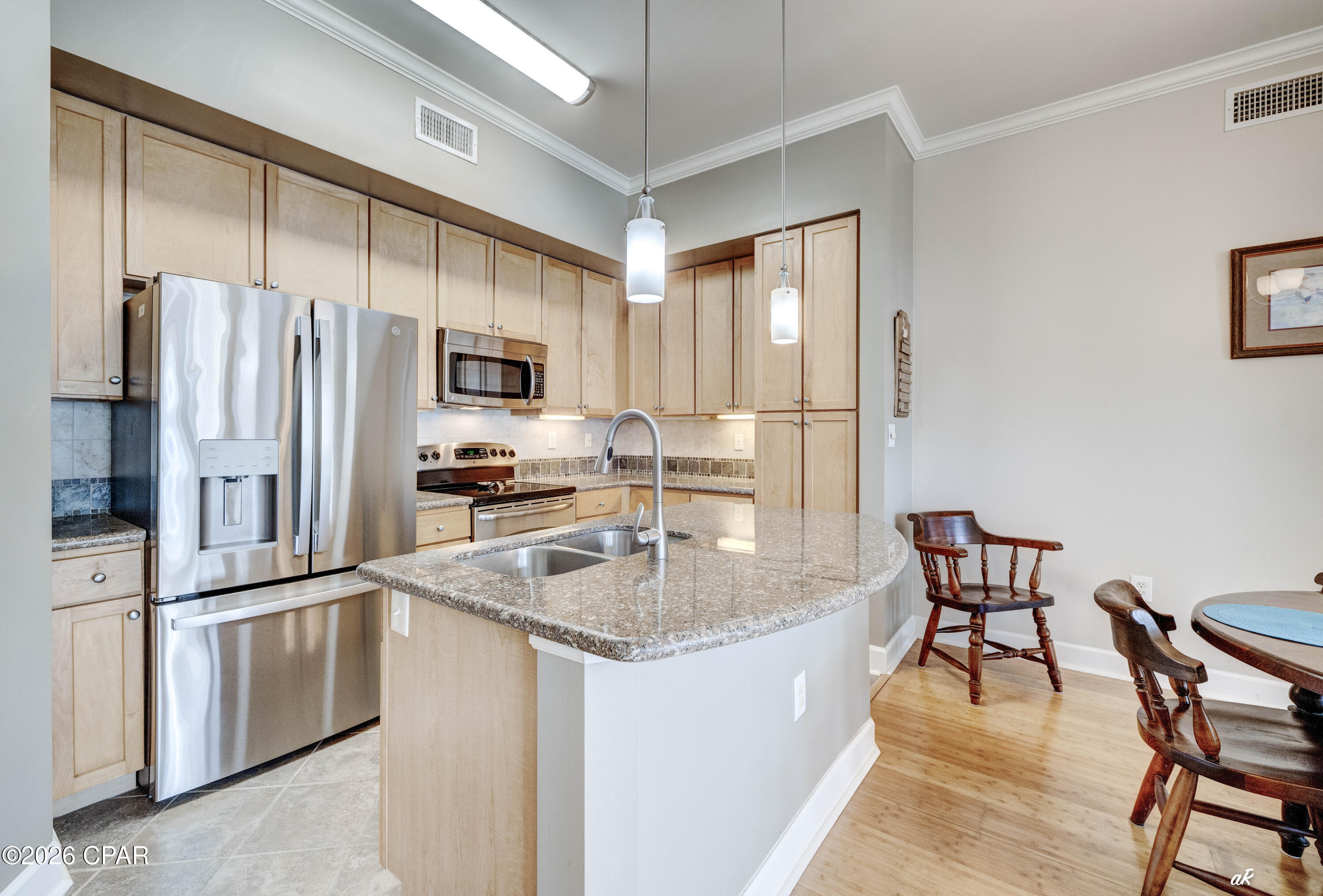 The kitchen features an exquisite granite island and countertops, ample cabinet and counter space, and stainless-steel appliances. The private balcony can be accessed from the living room and both bedrooms, making it perfect for entertaining or relaxing at the end of the perfect beach day. The primary suite serves as a true sanctuary, complete with an en-suite bathroom featuring a garden bathtub, a separate shower, and walk-in closet. The generously sized guest bedroom also has an ensuite bathroom offering privacy and convenience for family members or guests. Updates include refrigerator, washer, & dryer 2024, and the shower has been retiled. This second-floor unit is situated steps from the parking garage, no elevator or stairs needed to access your home.
Island Reserve is an exclusive gated resort community offering top-notch amenities, including a luxurious one-acre resort-style lagoon pool, state-of-the-art fitness facilities, billiard and game rooms, a media center with a 100'' theater screen, basketball, and pickleball courts. The courtyards surrounded by lush landscaping and strategically placed benches to ensure maximum enjoyment. The community in centrally located close to popular attractions, dining and shopping options, as well as the stunning Gulfs white sandy beaches and emerald, blue green waters. Don't let this incredible property slip through your fingers! Why wait? Schedule a tour today and see for yourself the amazing lifestyle you could enjoy--reach out to a realtor now to make it yours. All information is approximate and should be verified by the buyer if deemed important.