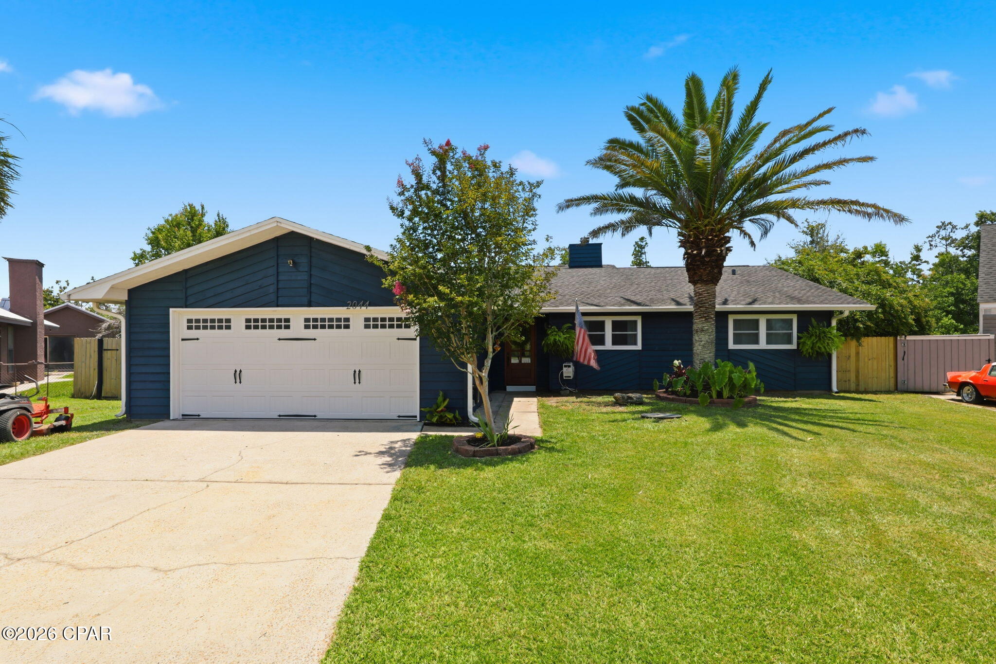 Beautifully updated and move-in ready! This 3-bedroom, 2-bath single-story home offers 1,808 sq ft of comfortable living on a generous 0.3-acre lot in the established Sandy Creek neighborhood in East Bay County -- with no HOA. The renovated kitchen is a showstopper, featuring shaker cabinetry, stone countertops, a subway tile backsplash, farmhouse sink, stainless appliances, and a large island with seating that opens to the living and dining areas. Gather in the light-filled great room beneath a striking wood-beam ceiling anchored by a fireplace and shiplap accent wall. Both baths are tastefully updated, and the spacious primary suite offers a walk-in closet and spa-style bath. Enjoy year-round relaxation in the oversized screened porch overlooking a large, fully fenced backyard with mature shade trees. Minutes to Tyndall AFB, shopping, and Panama City. Schedule your showing today!
