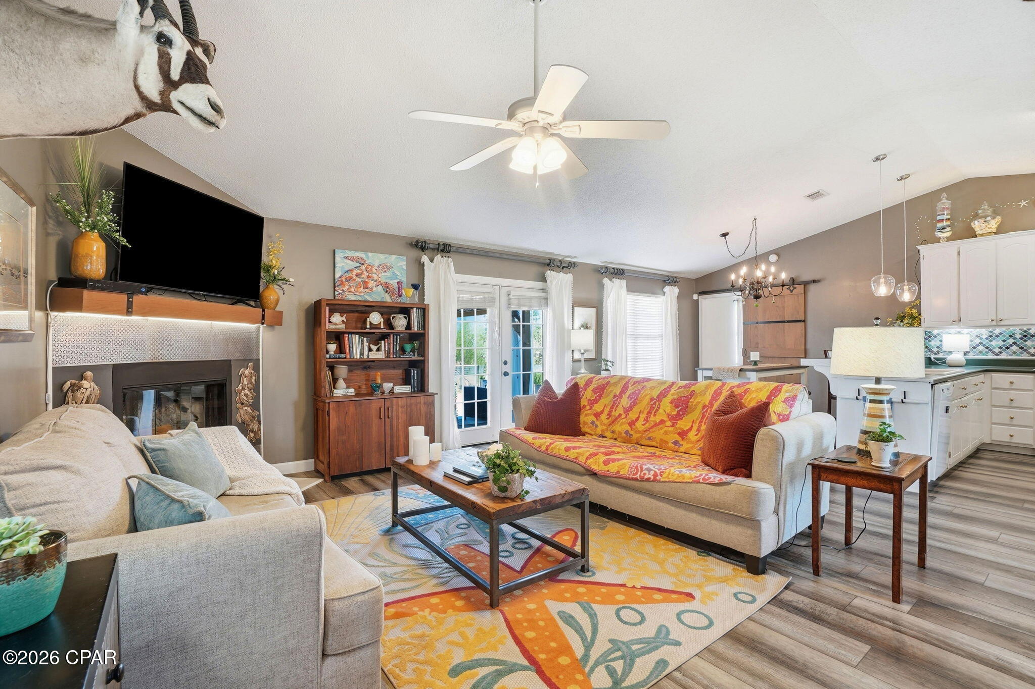 Welcome to your beautifully renovated 3-bedroom, 2-bathroom country oasis tucked away on a quiet waterfront lot. With minimal traffic and a golf cart-friendly neighborhood, this country gem offers the perfect blend of privacy, convenience, and lifestyle. Step inside to discover a spacious open-concept main living area filled with natural light. A lovely fireplace serves as the focal point of the living room, flanked by French doors that lead directly out to a large deck overlooking the pond. In the dining and kitchen area, you'll find a beautiful backsplash, spacious pantry, and convenient breakfast bar--perfect for simple meals or a buffet station when entertaining family and friends. The home has been thoughtfully updated from top to bottom featuring: New roof, air conditioner, siding, LVP flooring, fresh interior paint, designer backsplash, and updated lighting fixtures. The outdoor space is just as impressive! Enjoy spending time on your wonderful open deck, spacious back yard, or feeding the fish and turtles down by the pond. There is even a garden area and a citrus tree for those who love to grow their own produce plus a spacious new shed and lean-to that can be used as a workshop, man cave, she shed, or extra storage. Whether hosting summer gatherings or enjoying a quiet evening under the stars, this backyard truly delivers. Additional highlights include a large Primary Suite w/ a Jacuzzi tub and walk-in closet, a double garage, a sprinkler system, a Culligan water filtration system, a corner lot location, and a split bedroom layout offering both comfort and functionality to everyday living. Like to fish? There are 2 boat ramps less than a half mile away. Launch your boat, jet ski, or kayak into Deerpoint Lake and enjoy some of our area's best freshwater fishing! Homes like this -- updated, move-in ready, no HOA, and no flood insurance required -- don't come along very often. CALL TODAY FOR MORE INFORMATION!