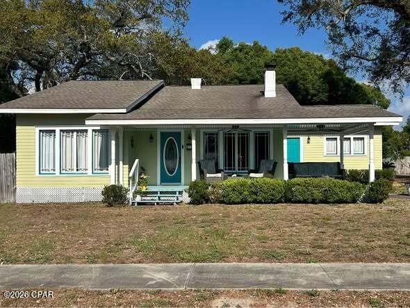 1931 bungalow with Grandmillennial style! Both Southern charm and Florida flare.  2 bedrooms, 2.5 baths with a bonus room. Artfully refinished with handcrafted crown molding and baseboards, hardwood floors, front sash windows, new back windows, tongue and grove bead board ceilings, clawfoot soaking tubs and elegant light fixtures with medallions in every room give this home that real heirloom feel while still providing modern touches. Home sits on .41 acres shaded with mature live oak trees and palm trees. Backyard is completely fenced and private with covered and uncovered patio. There is room for RV or boat parking. Large storage shed with plenty of shelving and a greenhouse!