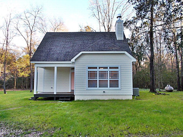 This custom built home is very nice and ready to move in, just outside of city limits,and in a private location, living room has travertine tile floors and plenty of natural lighting with a wood burning fireplace and tray ceilings, the kitchen with travertine floors has plenty of natural light as well from a skylight over the sink, all stainless steel appliances, and Premium Laminate counter tops, all very tastefully done, with 9 ft ceilings and canned lighting. Both bathrooms and laundry have travertine floors also, the master bedroom, wood stairway, 2nd bedroom have Handscraped Hickory Cocoa Engineered flooring.This home is very energy efficient with Hardi-board concrete siding and blown foam insulation and exterior 2x6 walls on first floor, there is a tankless hot water heater. There is an additional 3.22 ac that can be purchased with this home. Very easy to show call listing agent. Supra box