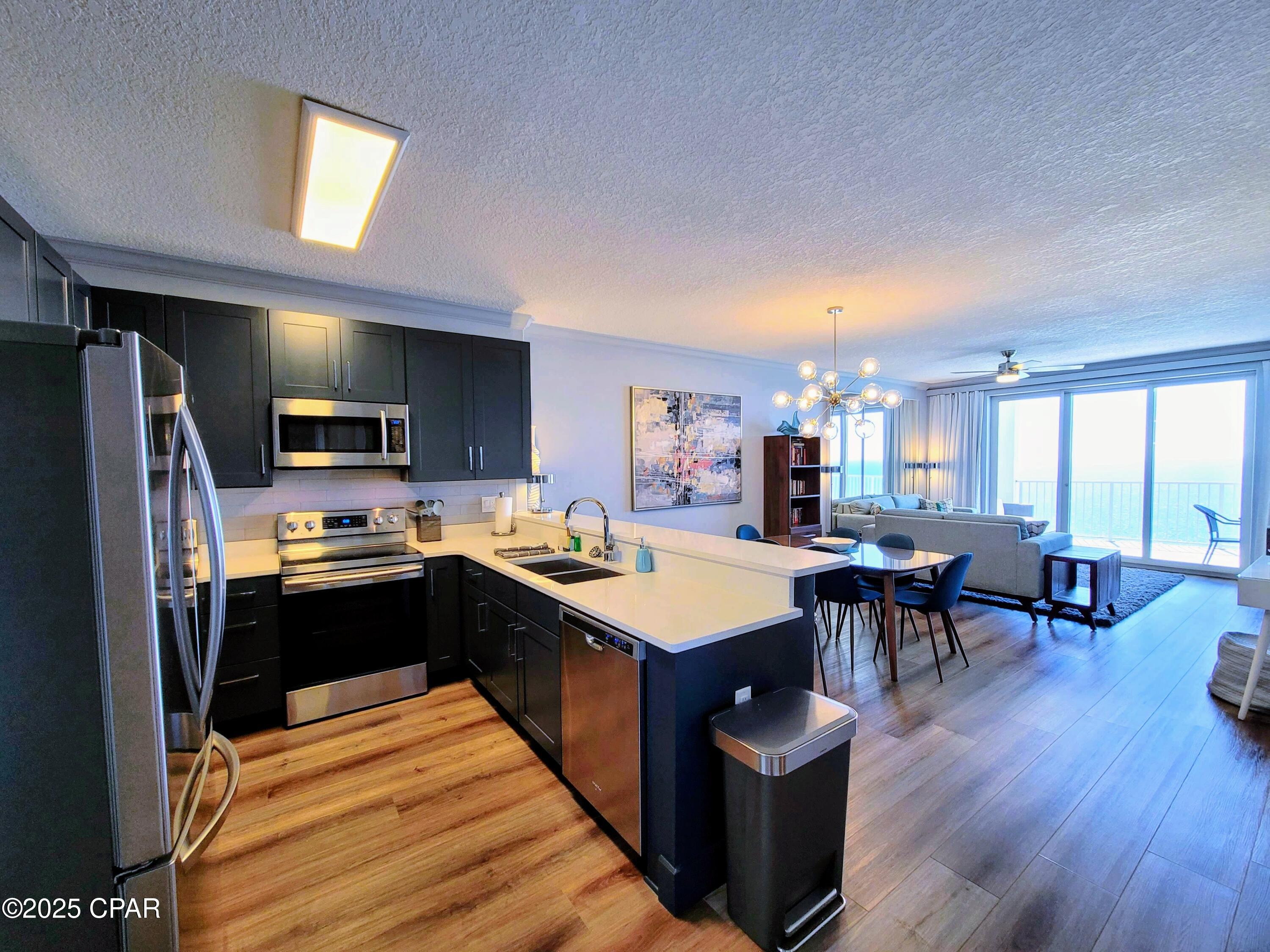 CURRENTLY UNDER CONTRACT, SELLER WILL CONSIDER BACKUP OFFERS' 
Step into luxury with this stunning 2-bedroom, 2-bath penthouse in the highly sought-after Twin Palms Resort! Perched on the 22nd floor, this unit offers unparalleled, panoramic Gulf views from its oversized, rounded balcony--one of the best views in Panama City Beach! Completely renovated, this condo features a chic, mid-century modern design with modern shiplap accent wall and sleek barn doors that add both style and character. The bathrooms are to die for, boasting luxury finishes and spa-like touches. The spacious layout surprises with more-than-expected storage and TWO owner's closets--a rare find in a condo. Offered fully furnished and rental-ready, this unit is a turnkey investment opportunity, consistently getting reservations as a successful vacation rental. The resort's prime location is perfect for family vacations--just a short walk to Walmart, Pineapple Willy's, and The Liq. Enjoy resort-style amenities, including a gulf-front pool, fitness center, and direct beach access to the sugar-white sands of the world's most beautiful beaches. Don't miss your chance to own this luxurious, penthouse retreat--whether as a dream vacation home or an incredible income-producing property! Schedule your private showing today!