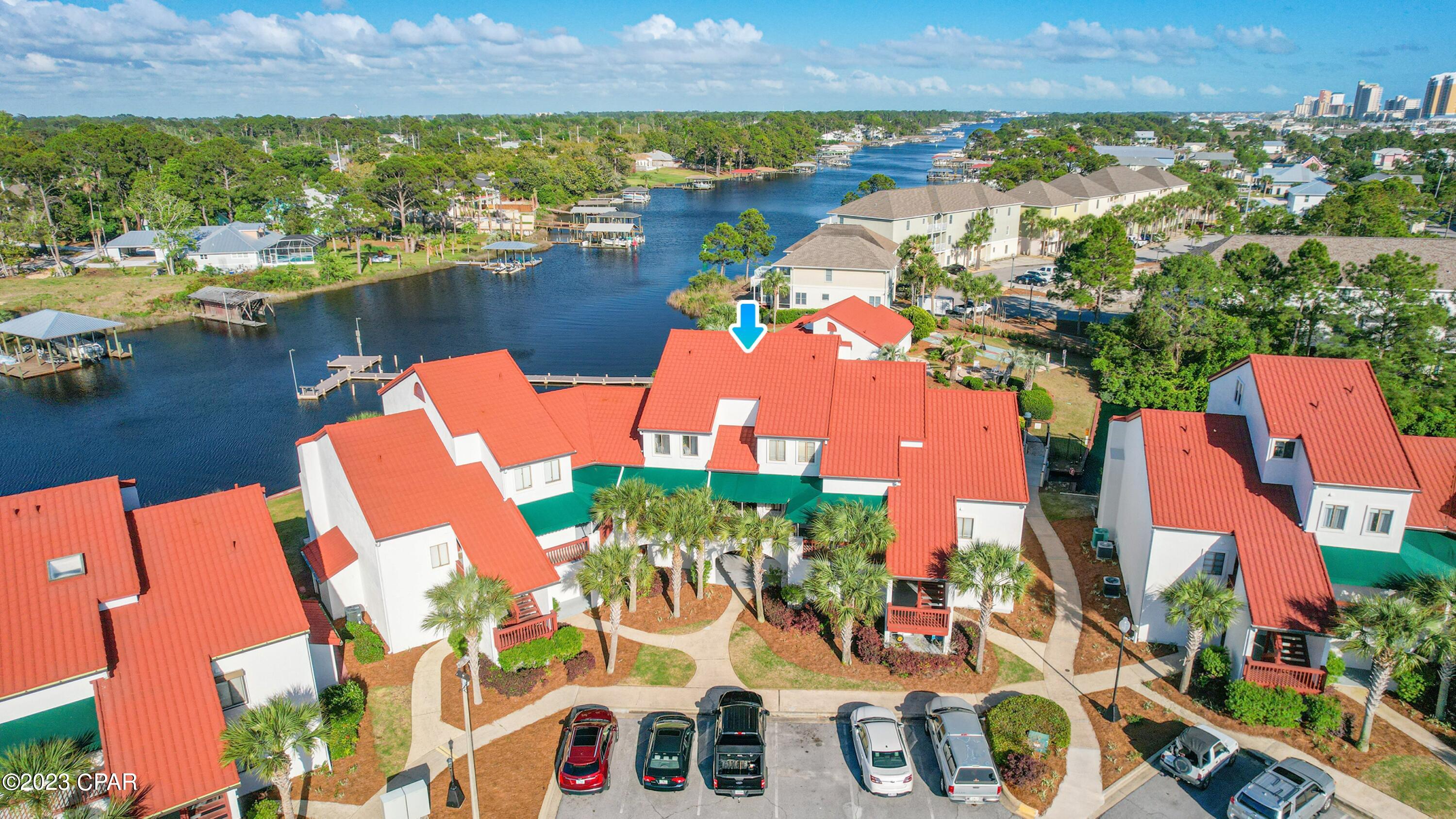 Amazing opportunity to own in one of the best locations in all of Panama City Beach. This great condo is just a short walk to a convenient public beach access, and you also have access to a canal that leads to the beautiful Gulf of Mexico, so by all means ... bring your boat! The floor plan is fantastic. With 3 FULL bedroom and 3 FULL bathrooms, there is room for everyone! The back deck offers expansive views of the canal and the stunning pool area. You have convenient shops within walking distance all around you ... heck you can even walk to dinner, a winery and much much more!  This amazing resort has a pool & sauna, a tennis court, a fishing area and a dock.