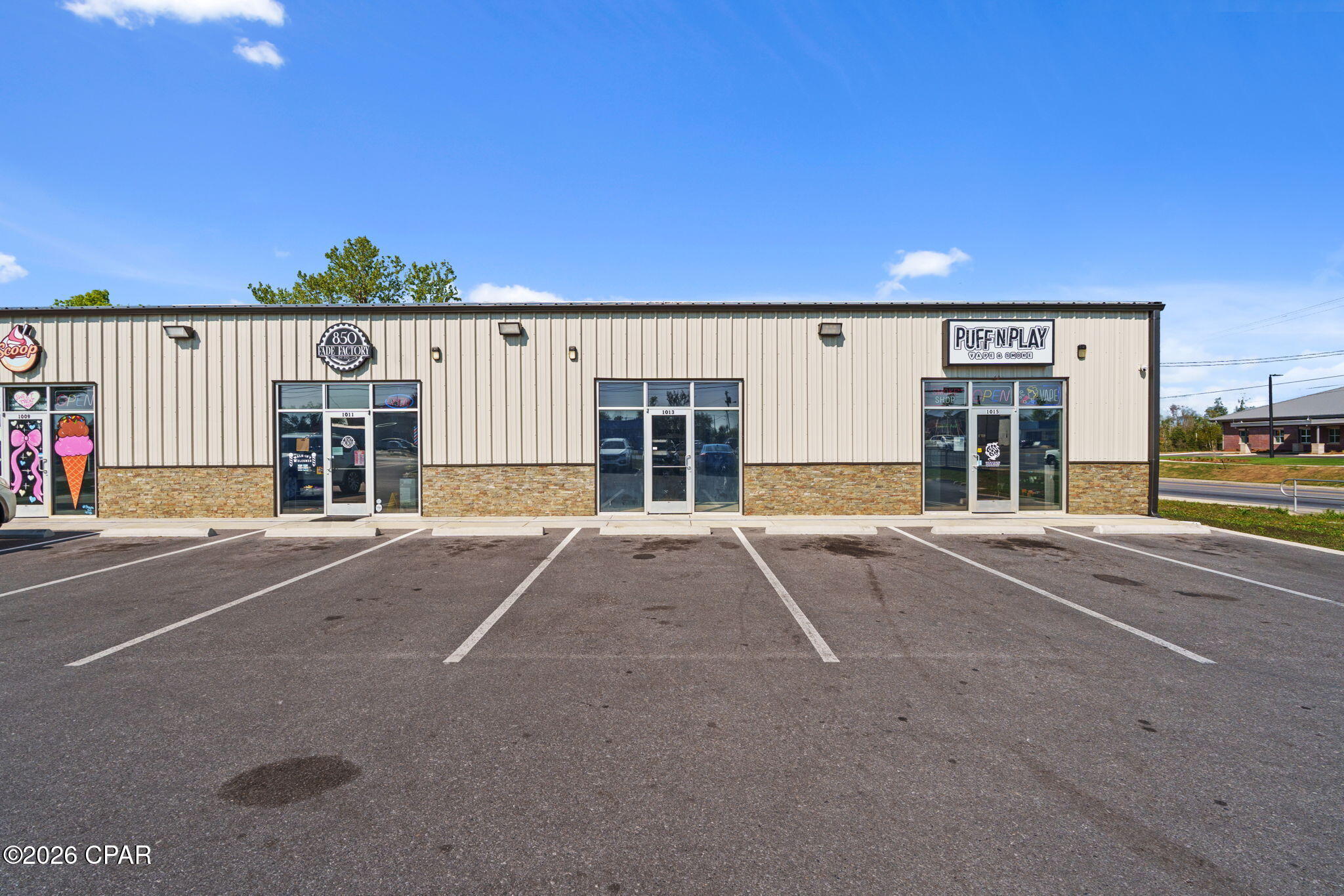 Maximize your business visibility in this brand-new, 1,075 sq. ft. commercial unit. Ideally located at the high-traffic corner of Transmitter Road and 11th Street, this metal-construction flex building offers a blank canvas suitable for retail, professional office, or light industrial use. Be the first to occupy this space, delivered in shell condition and featuring a private restroom, allowing for a fully customized tenant build out. Whether you need partitioned offices, open workspace, or a boutique retail layout, this unit provides the flexibility to design the space to fit your exact business needs. The property is located directly across from the new Springfield City Hall, providing consistent daily administrative and strong visibility. Positioned at a prime corner intersection across from a gas station and established apartment complexes, the location offers excellent exposure and easy customer access with convenient ingress/egress. The building includes modern firewalls and up-to-code fire safety systems, offering both safety and peace of mind. In the growing Panama City market, new construction flex space with immediate proximity to municipal hubs is rare. This unit combines the professional image of a new construction with the logistical advantages of a high-visibility corner location. An excellent opportunity for businesses looking to establish or expand in a rapidly growing area.