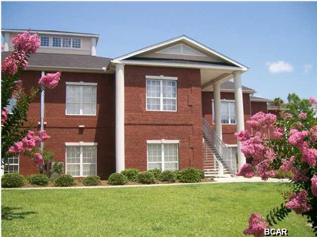 BAYSIDE ESTATES CONDO ... location, location, location! 3/2.5 approx. 2,308 SF condo situated directly on Johnson Bayou across street from St. Andrew's Bay. Only 8 units in this complex ... very private. Large entry opens into LR/Kitchen, 10' ceilings, crown molding, tile & carpet floors, custom cabinets, and large covered balcony overlooking bayou. Large master suite with area for sitting, walk-in closet and large bath. Kitchen has island with sink for washing those veggies and large corner walk-in pantry for storage. Home has 1/2 bath for guests and large laundry room with washer/dryer hookups. Detached 2 car garage with storage room that has separate lock. Just outside your door is a long walkway to dock where you can fish, sun bathe and take your bay boat or wave runner into