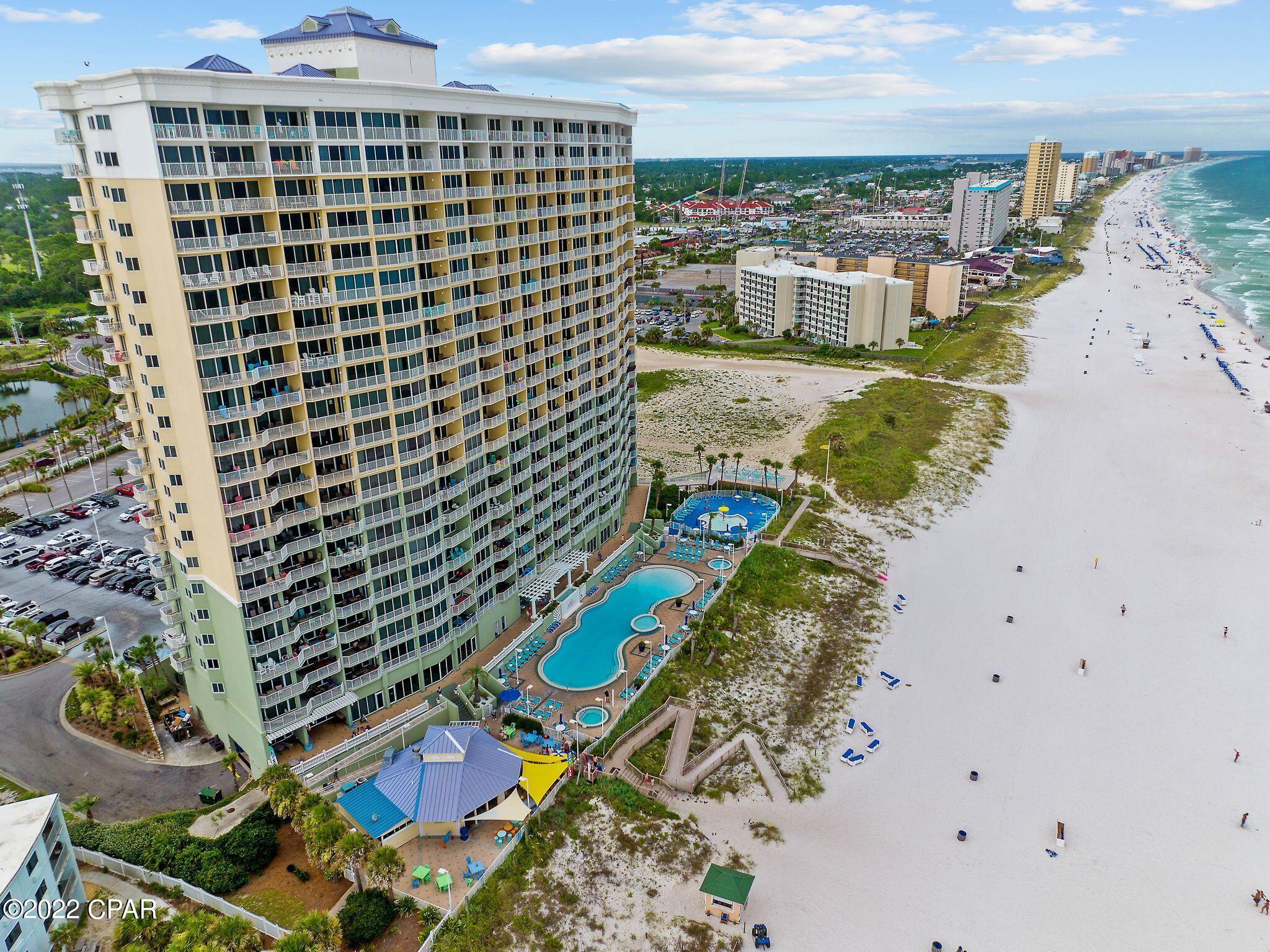 Boardwalk Beach Resort end unit with EFFICIENCY UNIT and bunk room. The resort is a popular destination for visitors with its expansive zero entry pool, tiki bar restaurant, interactive water park area for kids, and convenient location to restaurants and entertainment. This 3-bedroom plus bunk room unit features a kitchen with stainless steel appliances, efficiency unit with its own private kitchenette and balcony and expansive views of Gulf. The property also features a fitness center, covered garaged parking, 2 hot tubs, and arcade room. *Property is currently successfully managed by Royal American, and they would love the opportunity to continue to manage them.*