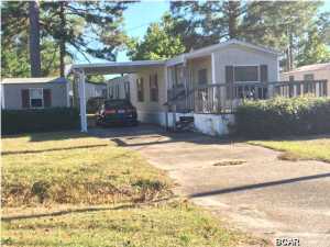 MOTIVATED SELLER & GREAT INVESTMENT OPPORTUNITY!! 2 Bedroom mobile home on Panama City Beach with porch, covered carport and utility building. Home in good condition and could be rental ready in a few days. All information is approximate and should be verified by buyer.